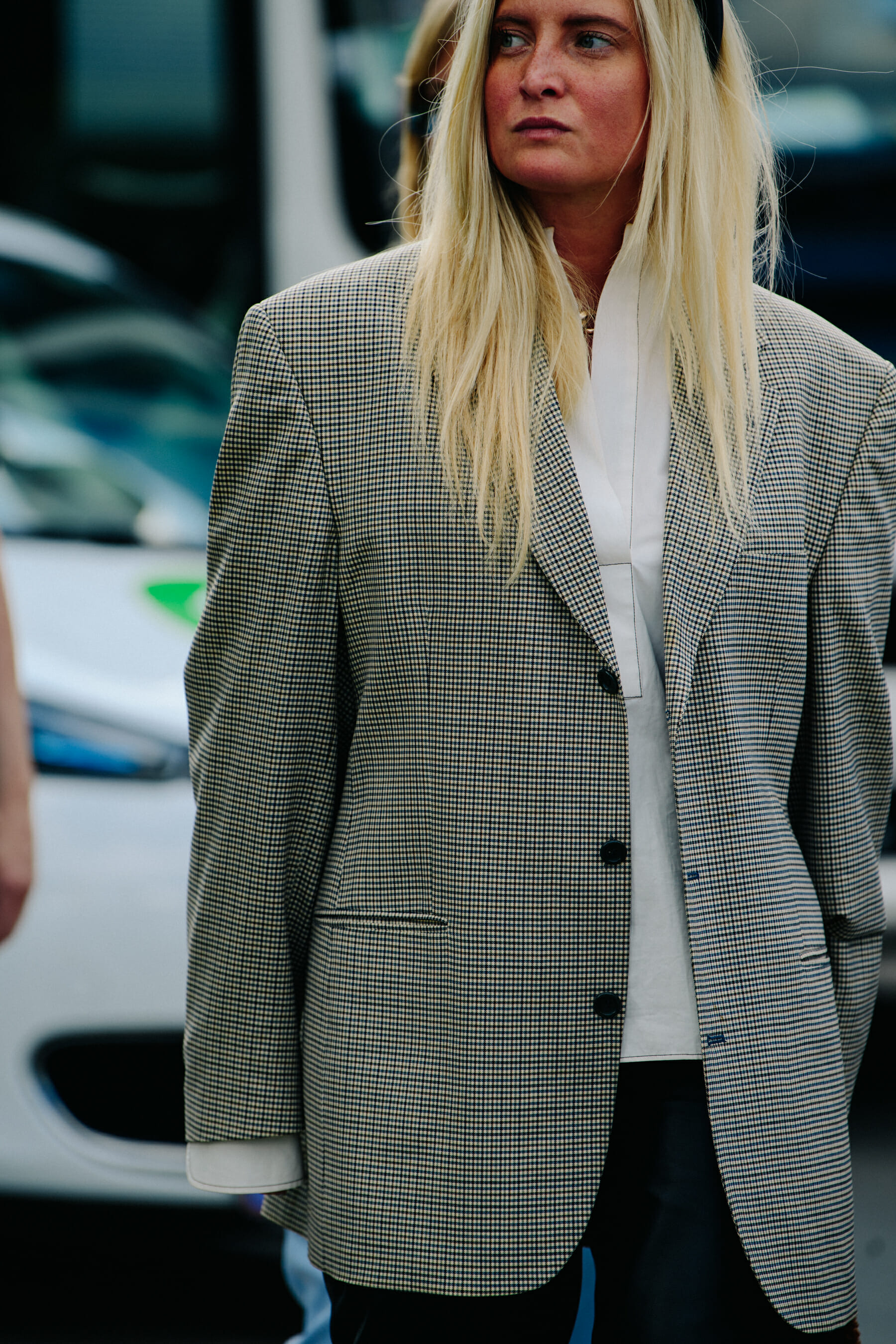 Woman wearing check blazer