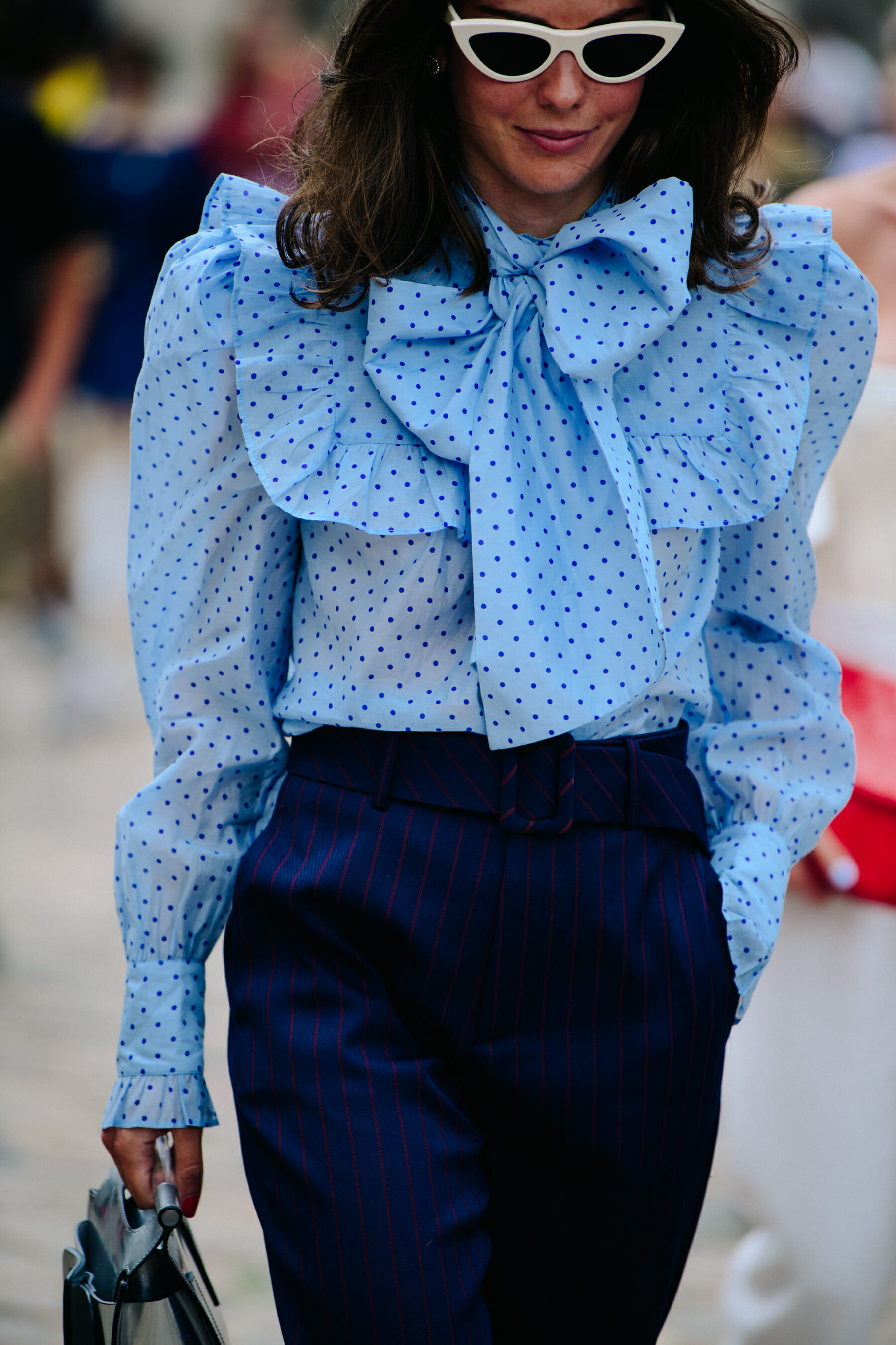 Woman wearing blue spotted shirt