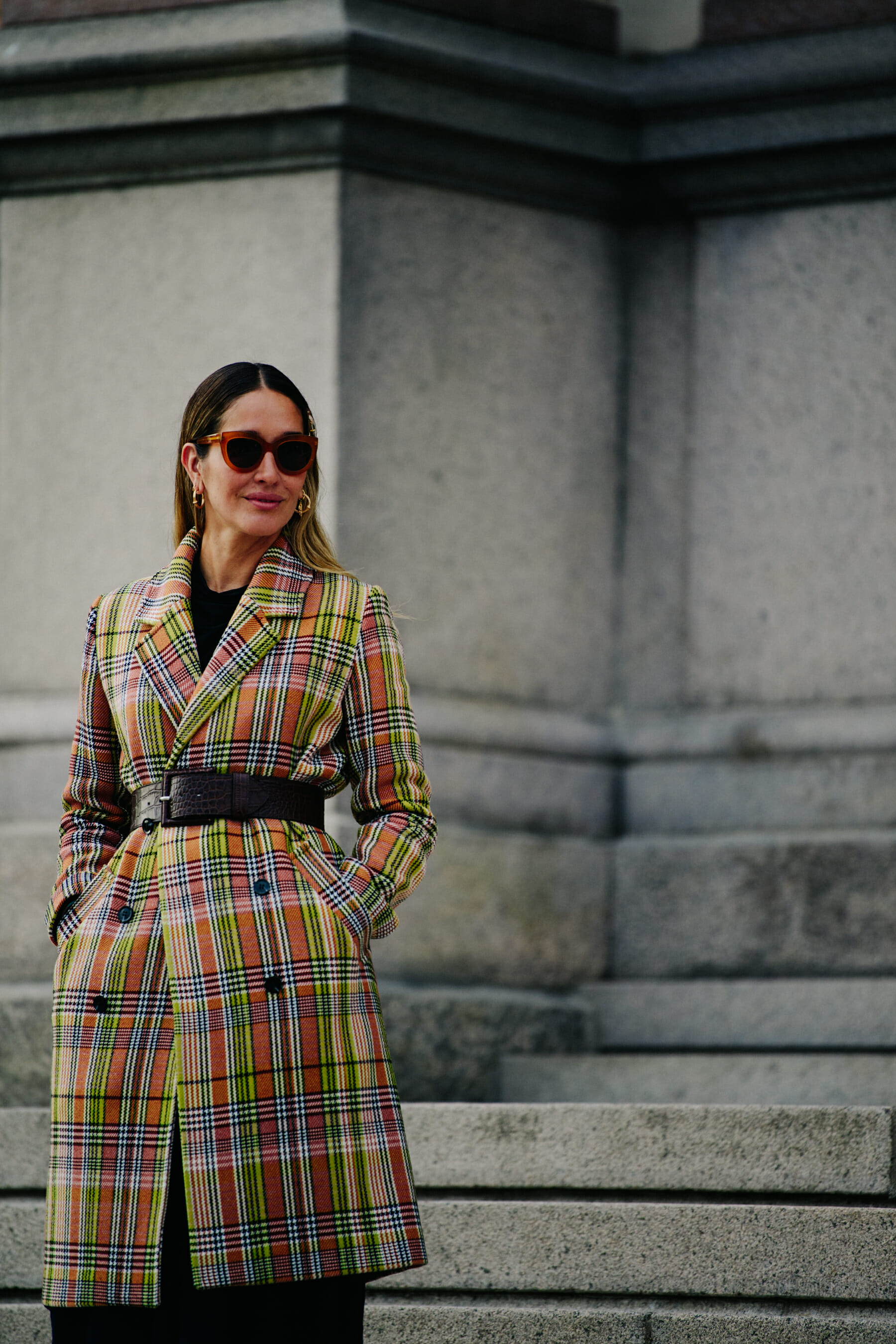 Woman wearing check blazer