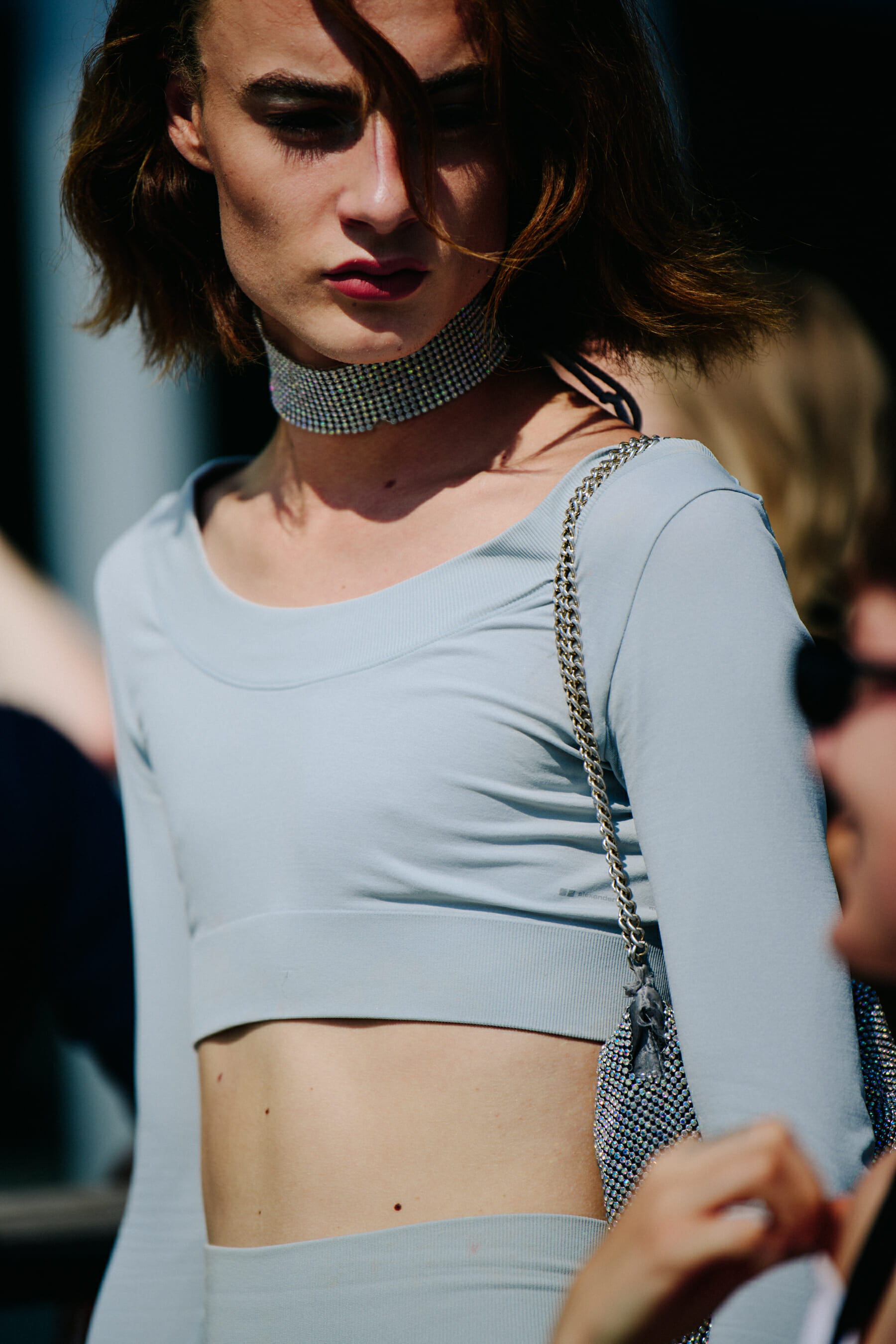 Man wearing blue crop top