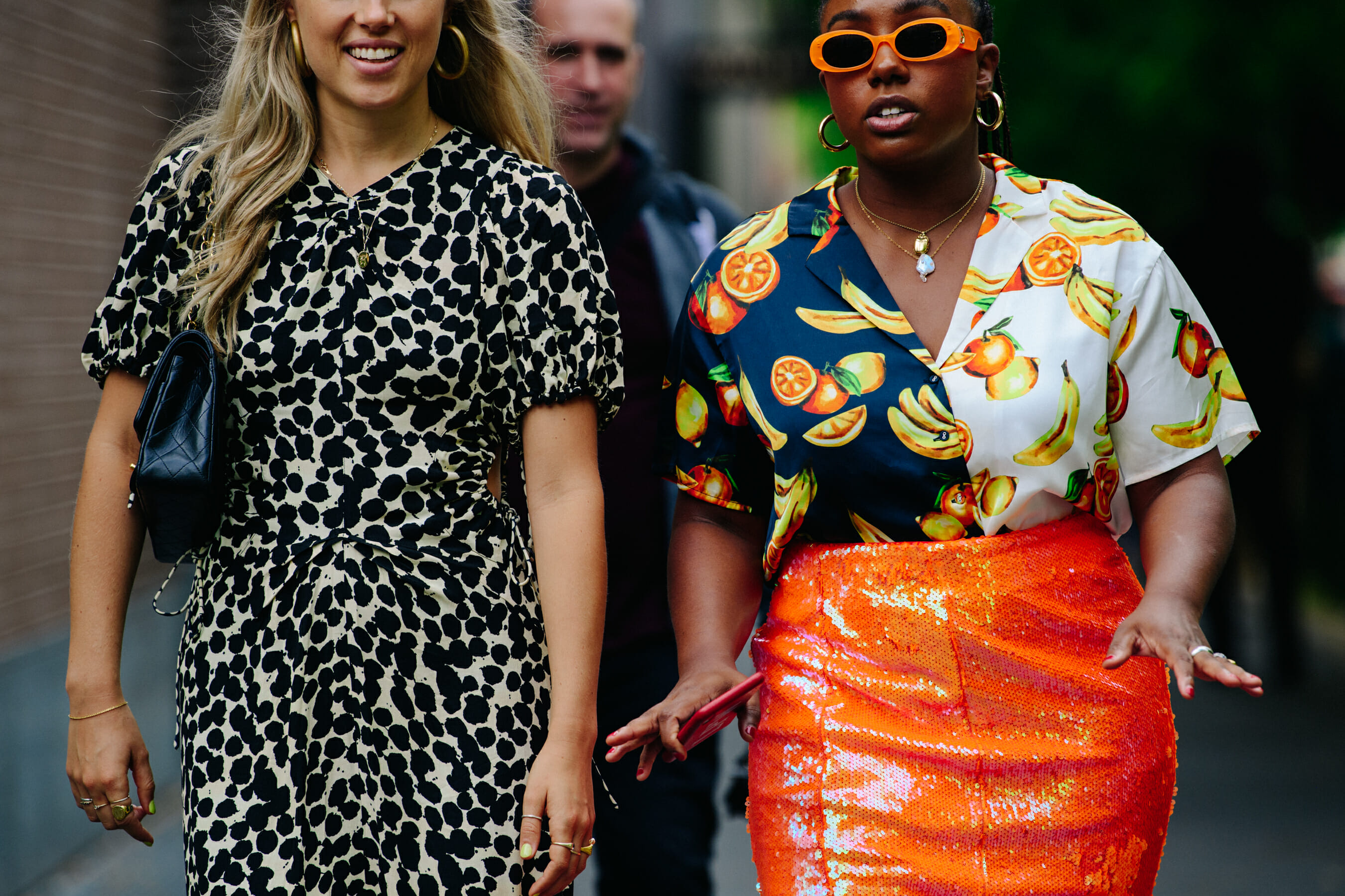Two women wearing pattern outfits