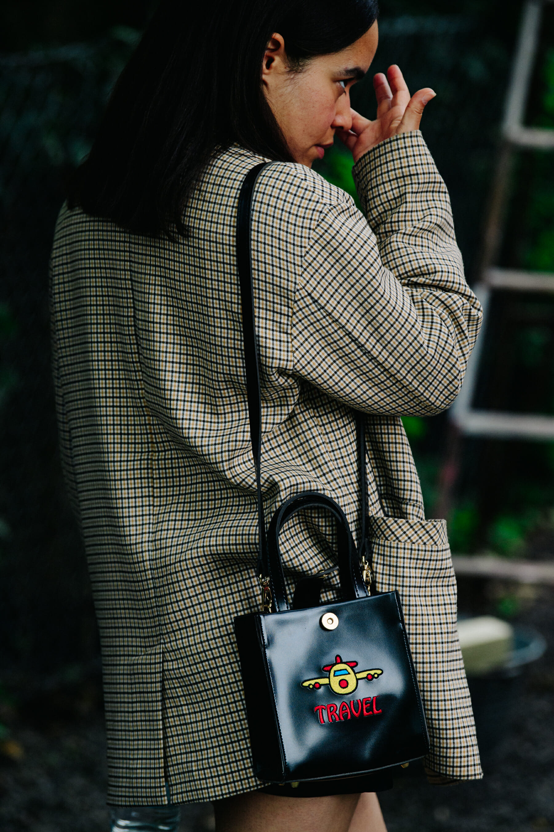 Woman wearing check jacket