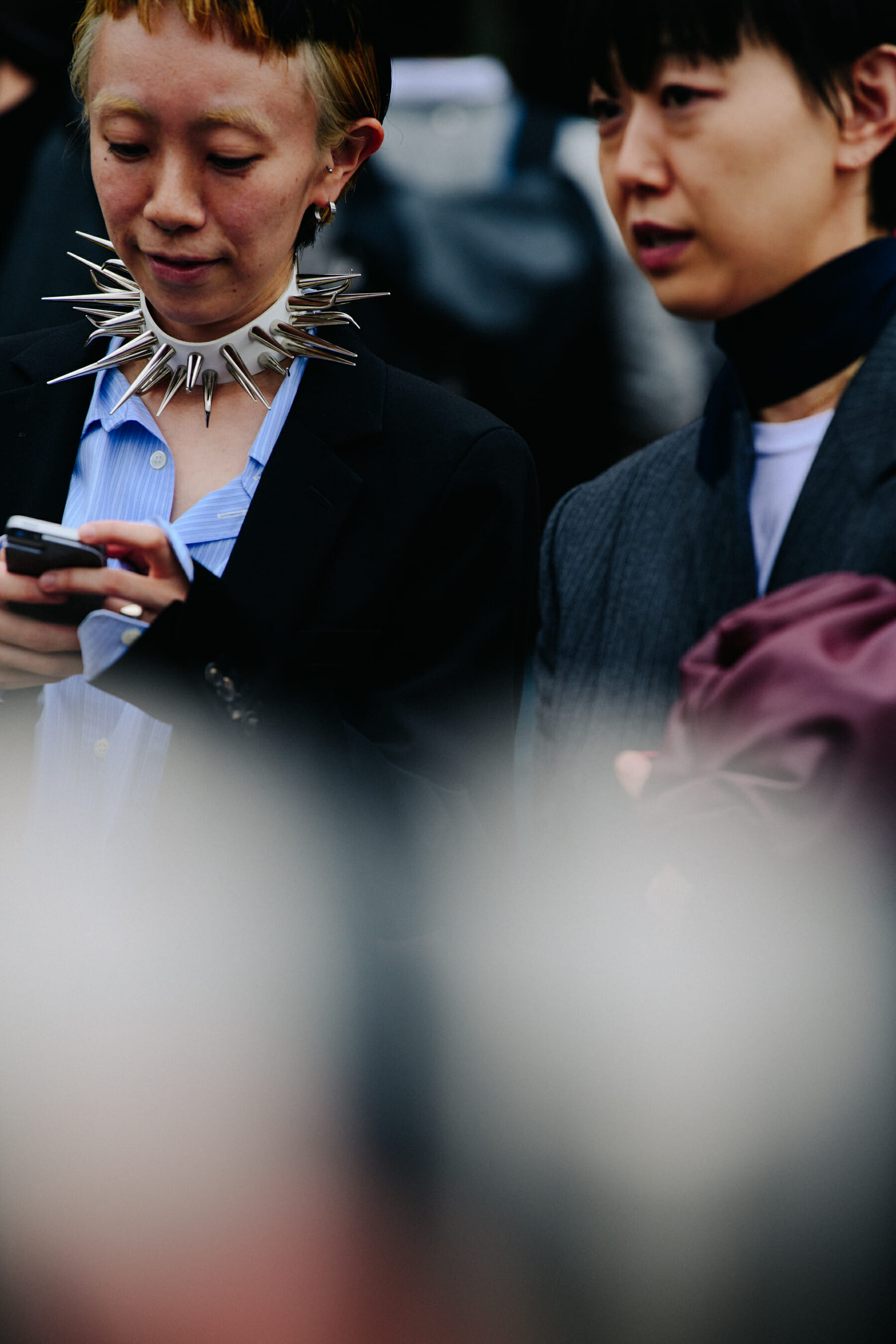 Woman wearing spiked neck collar