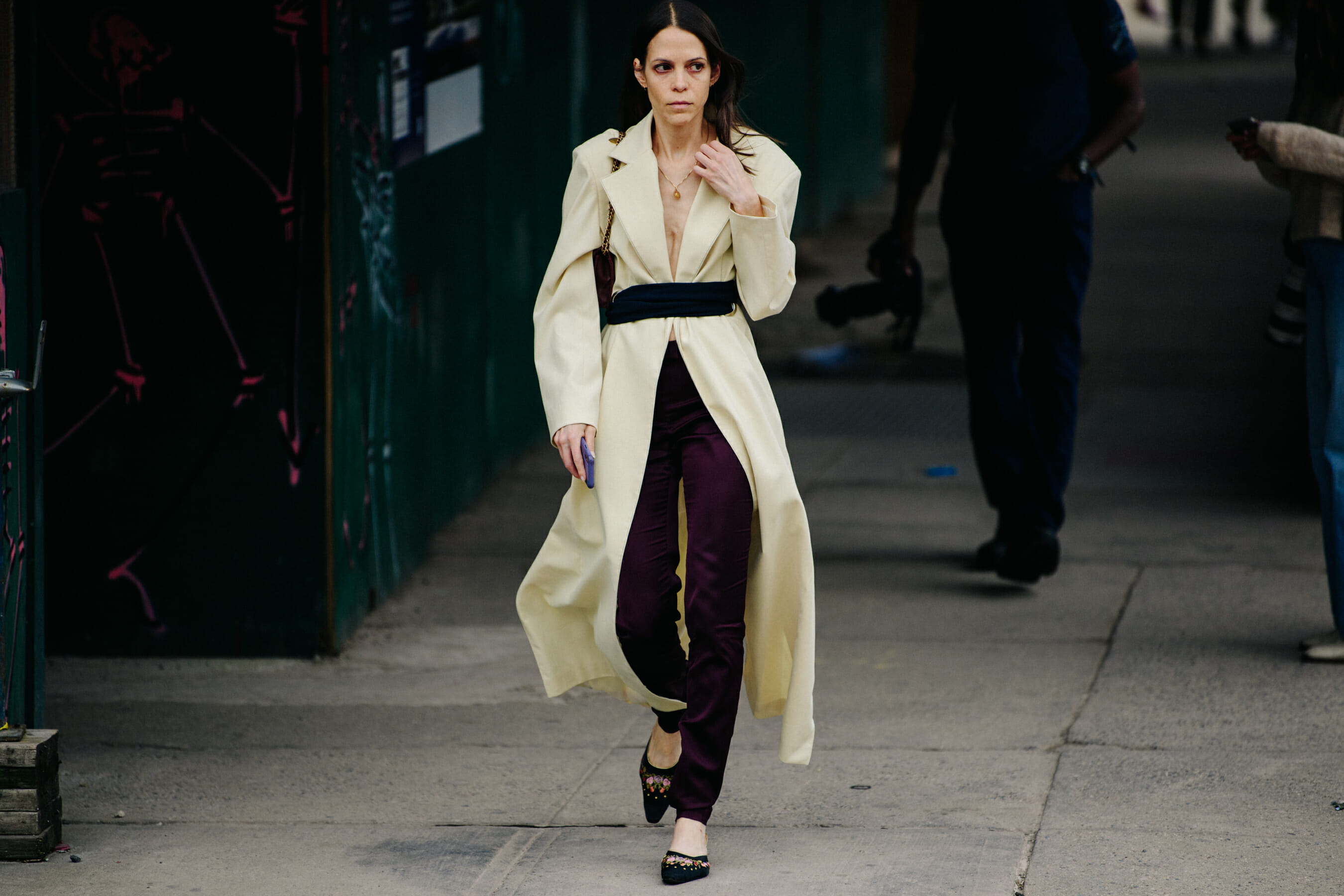 Woman wearing long yellow coat