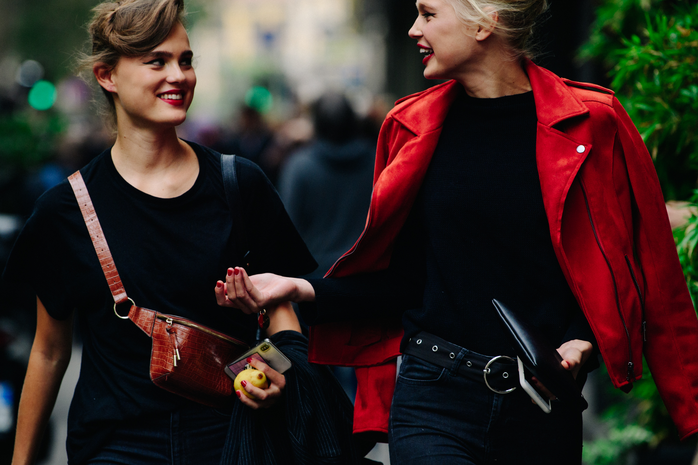 Two women wearing red lipstick