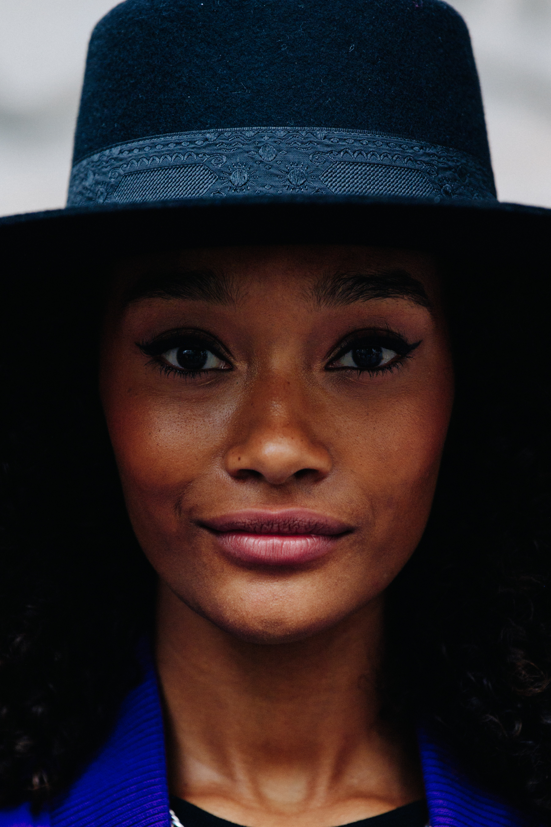 Portrait of model wearing black hat