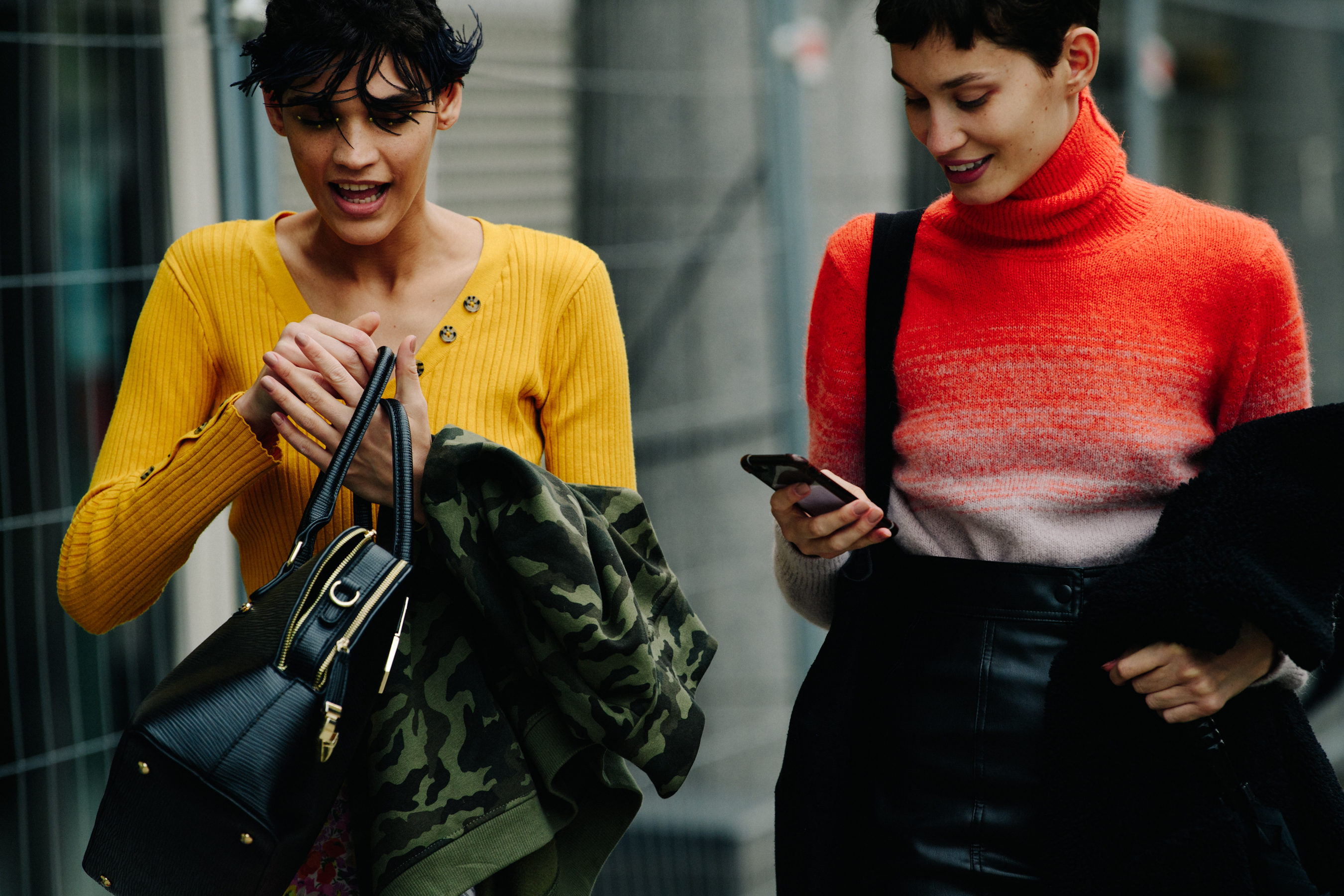 Two models wearing yellow and red