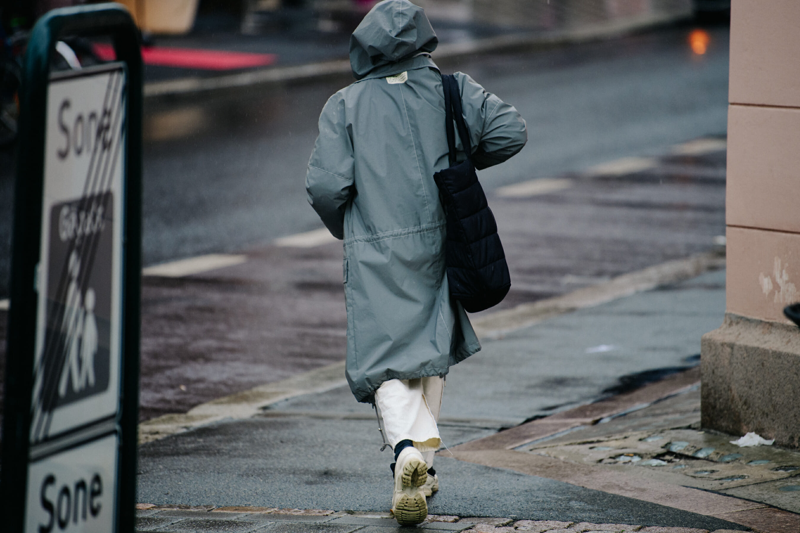 Man wearing grey coat