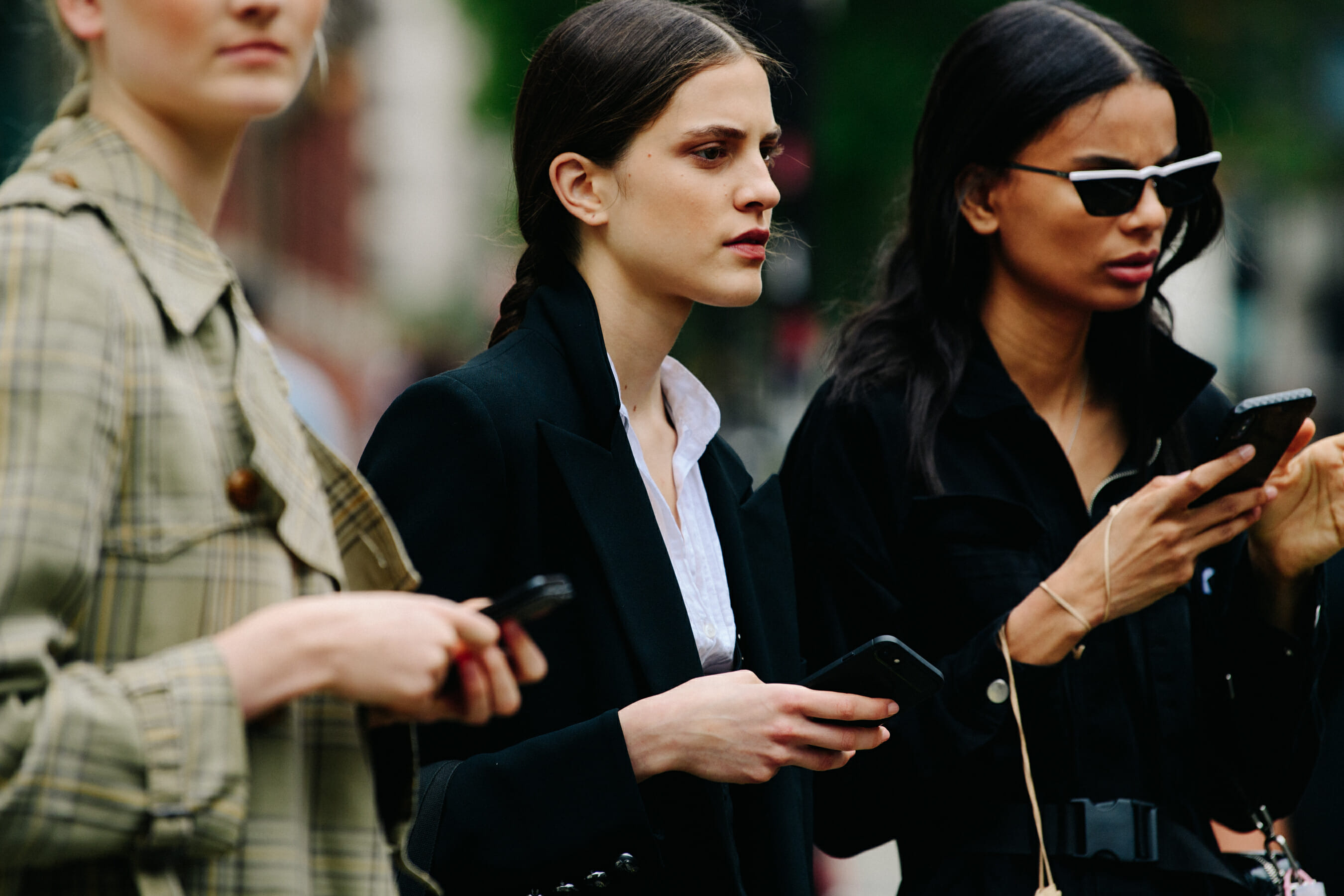 Two women wearing black outfits