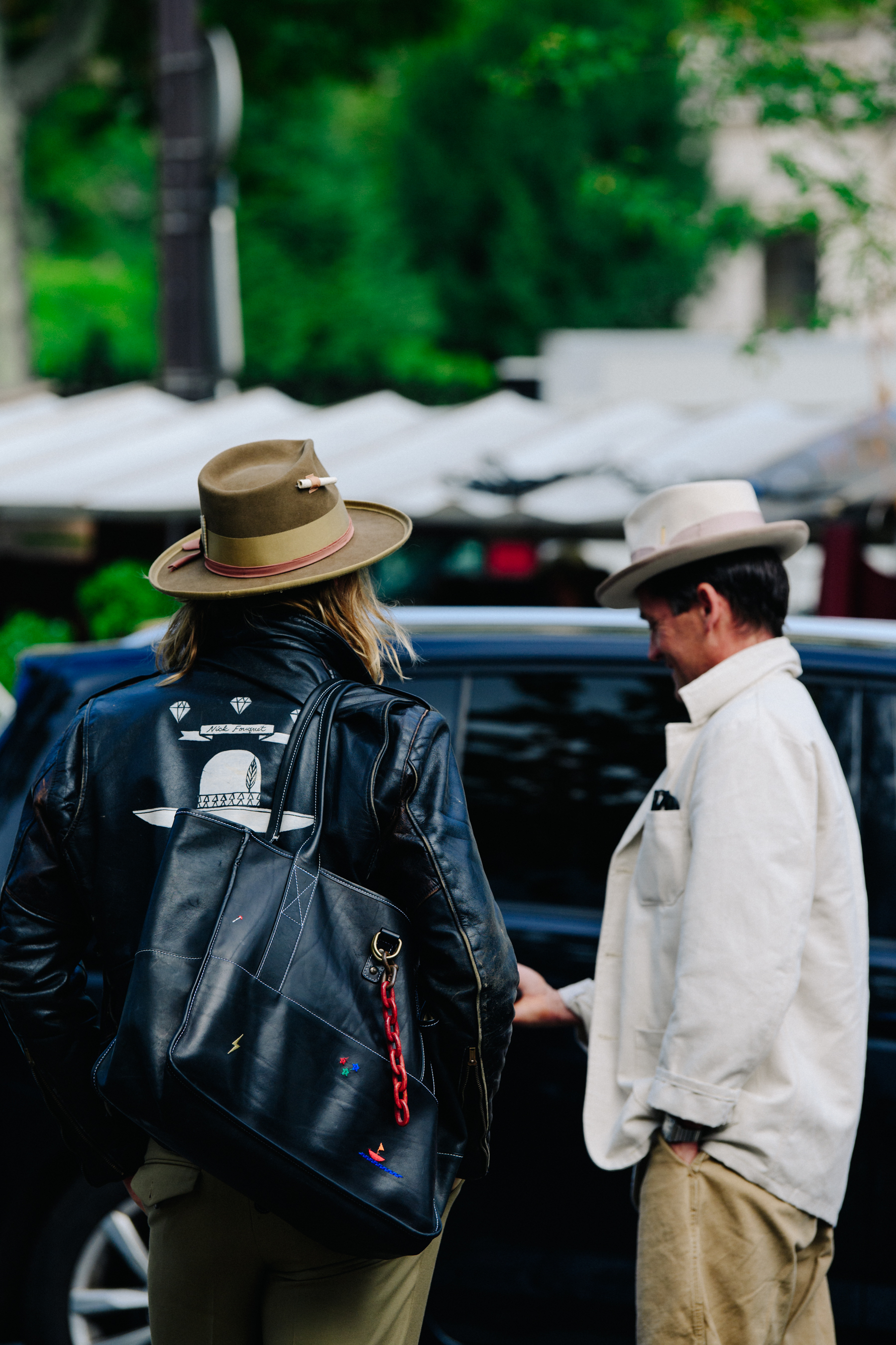 Two men wearing hats