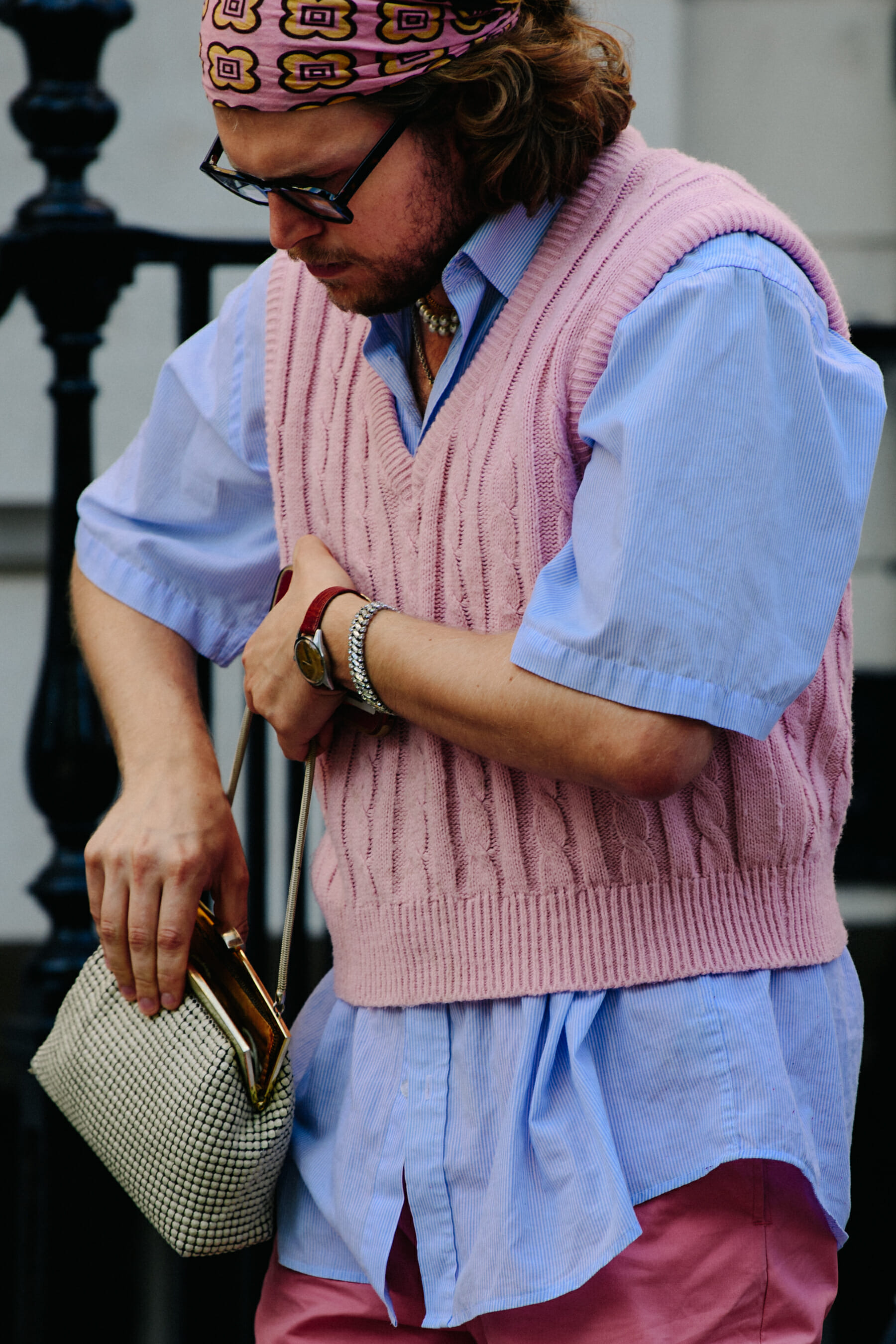 Man wearing pink wool vest