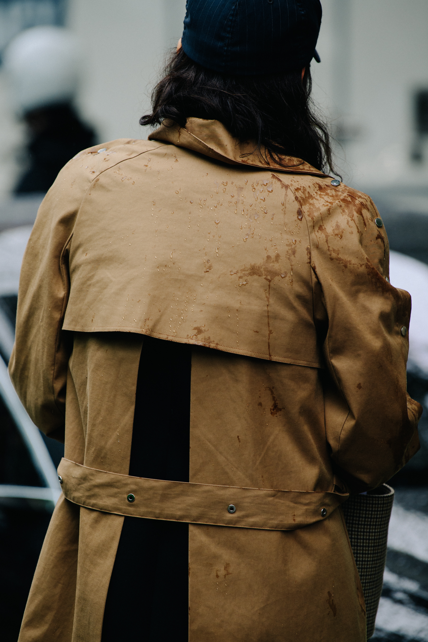 Woman wearing tan coat