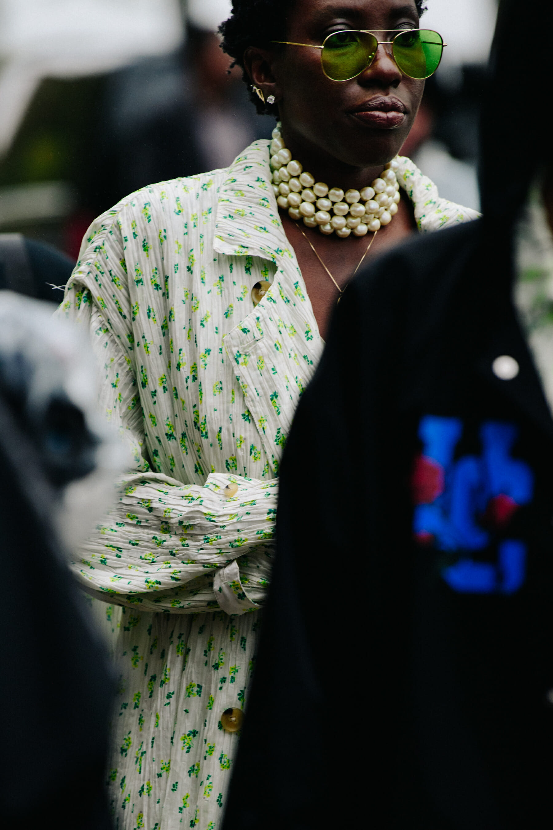 Woman wearing green floral shirt