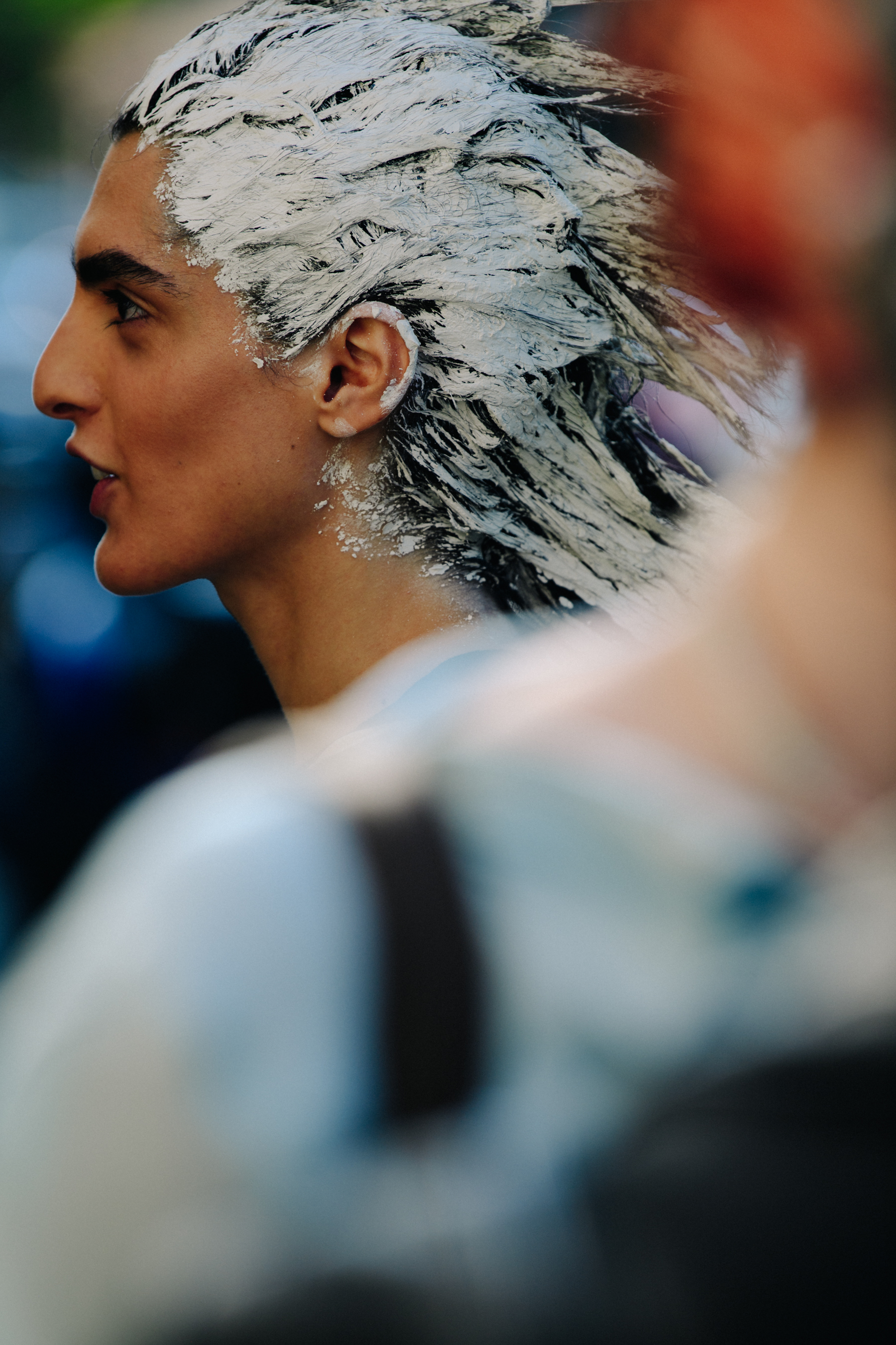 Model wearing white hair paint