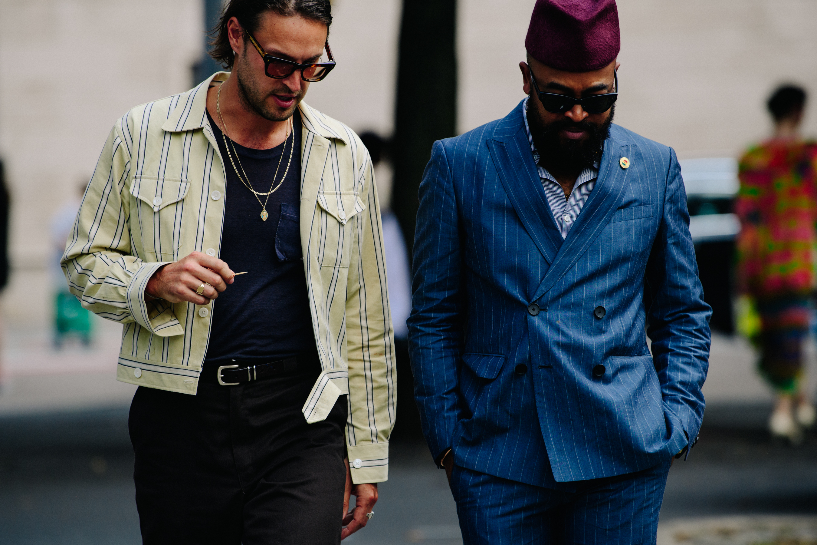 Two men wearing stripes