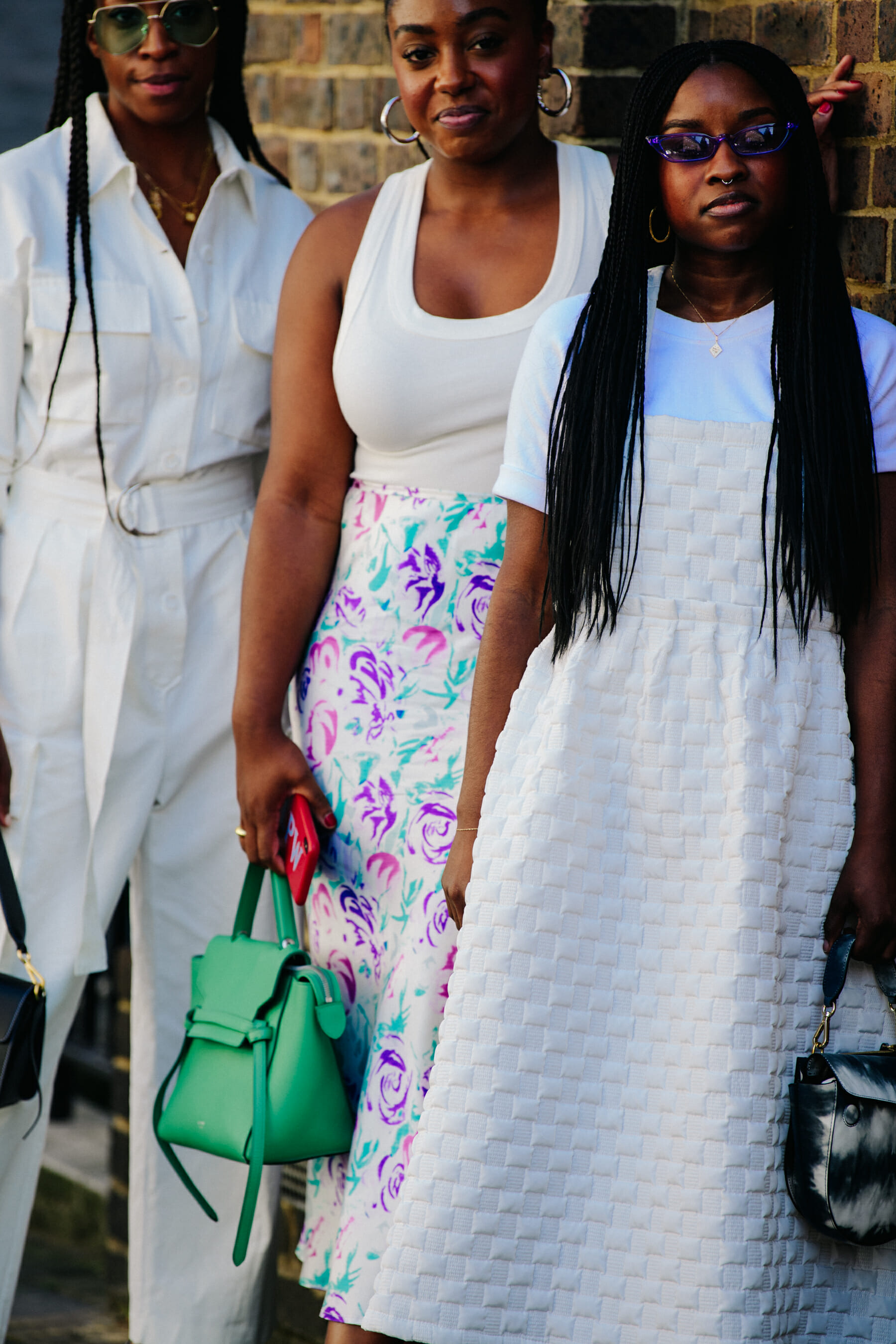 Three women wearing white