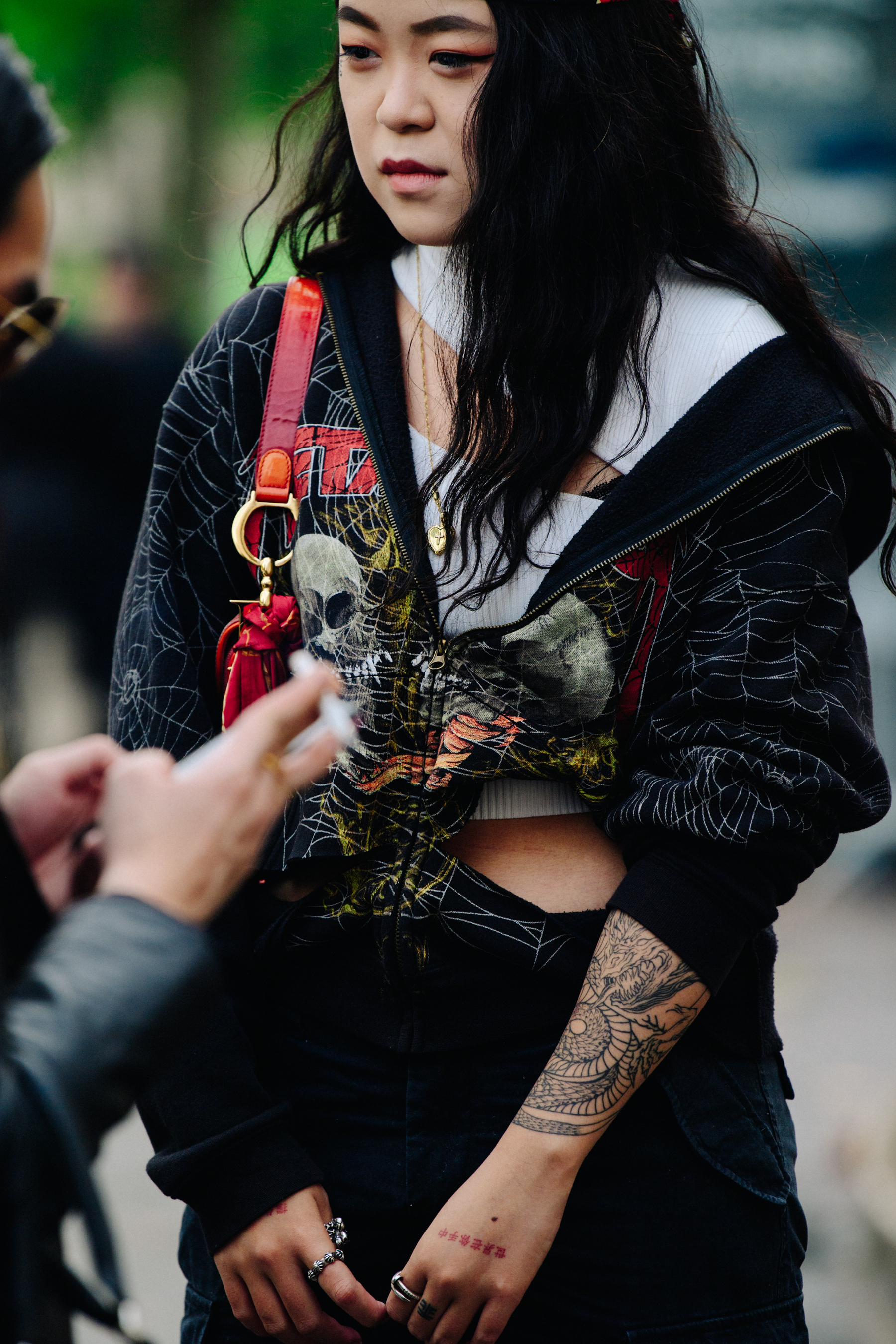 Woman wearing ripped hoodie