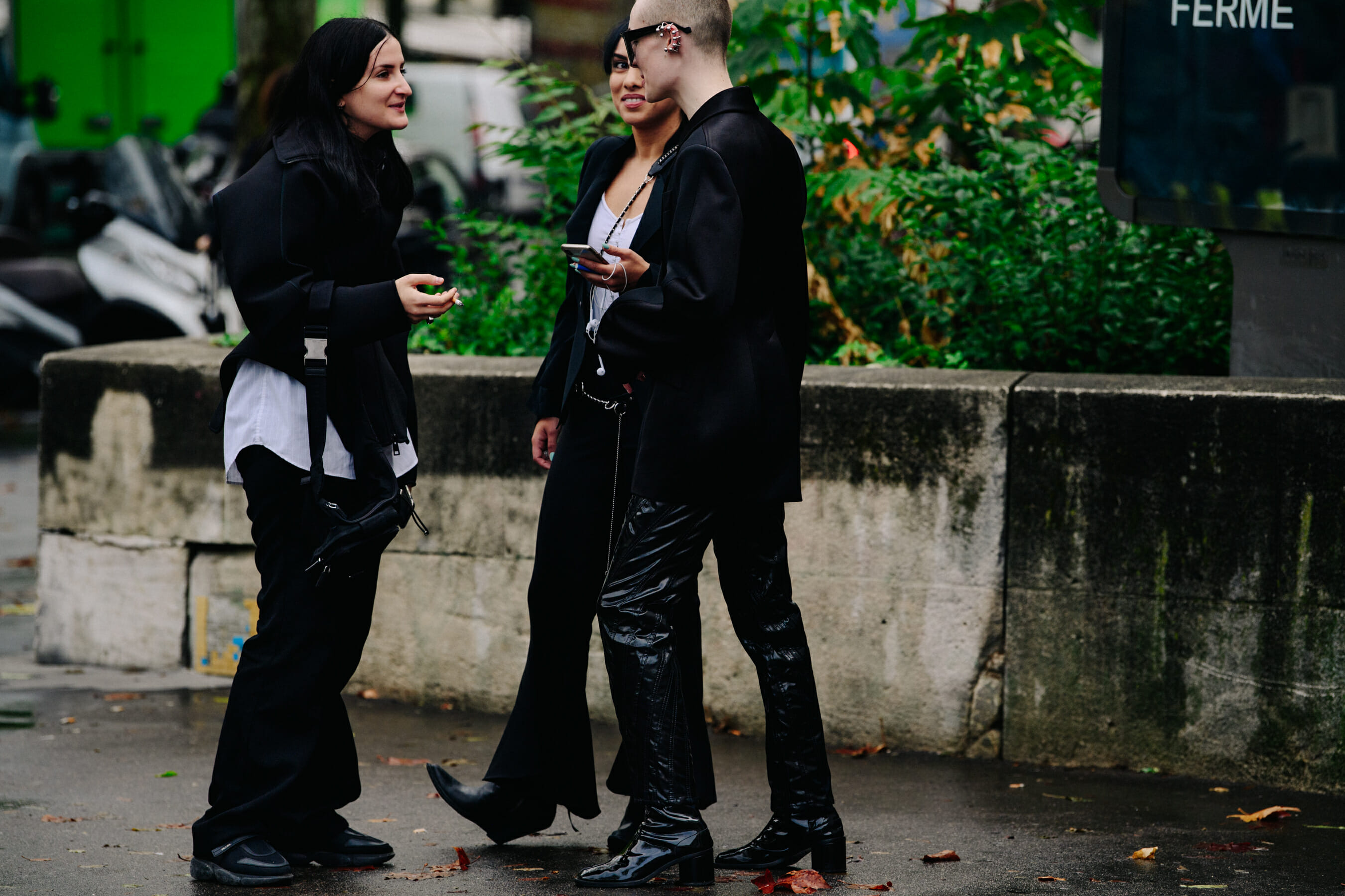 Three people wearing black
