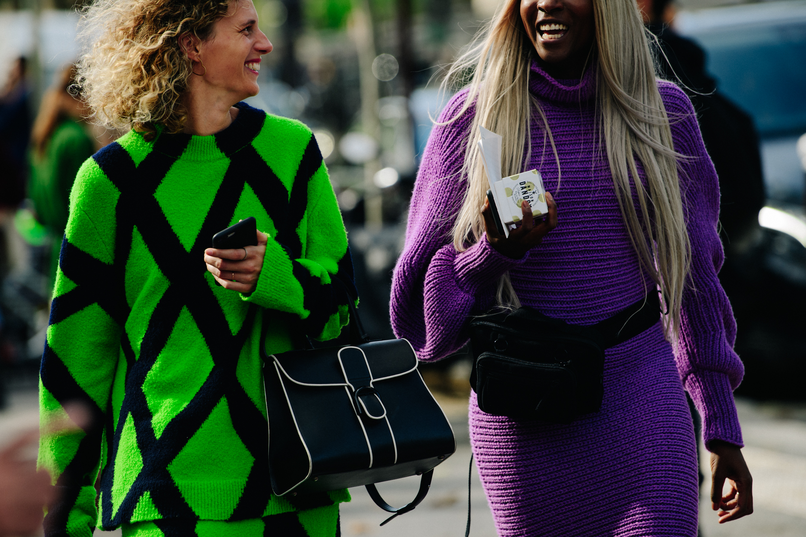 Two women wearing bright colours