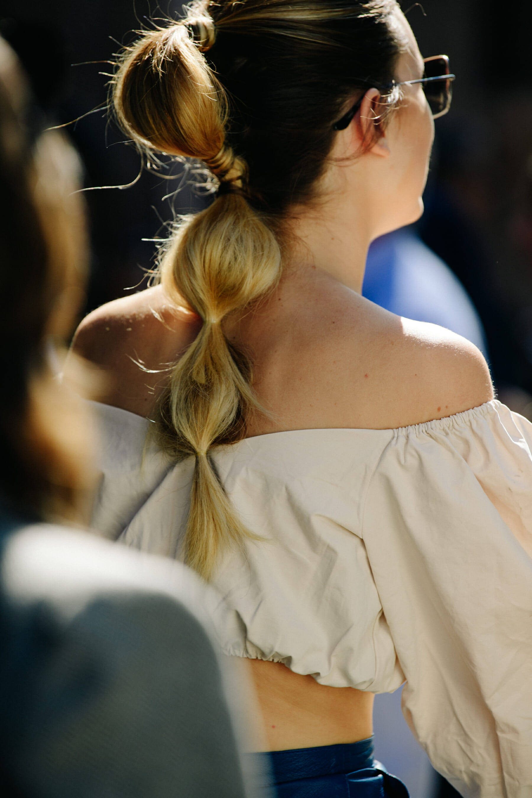Woman wearing tan crop top