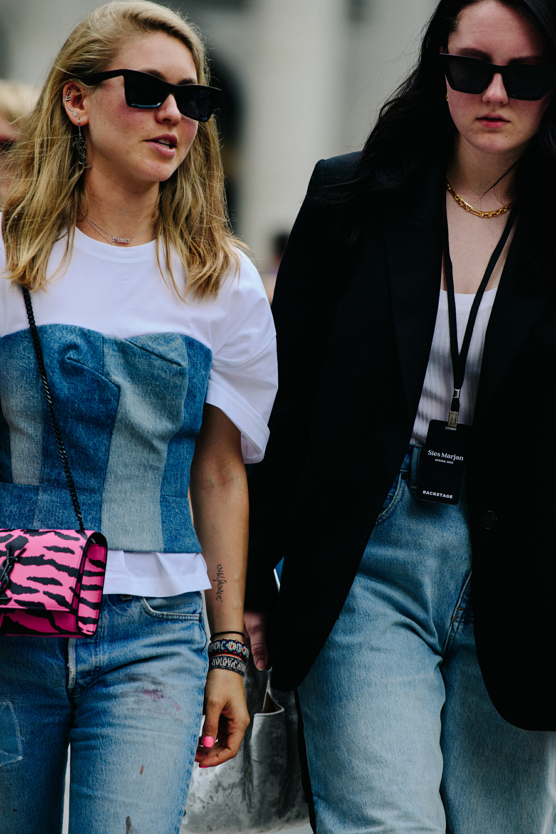 Two women wearing smart clothing