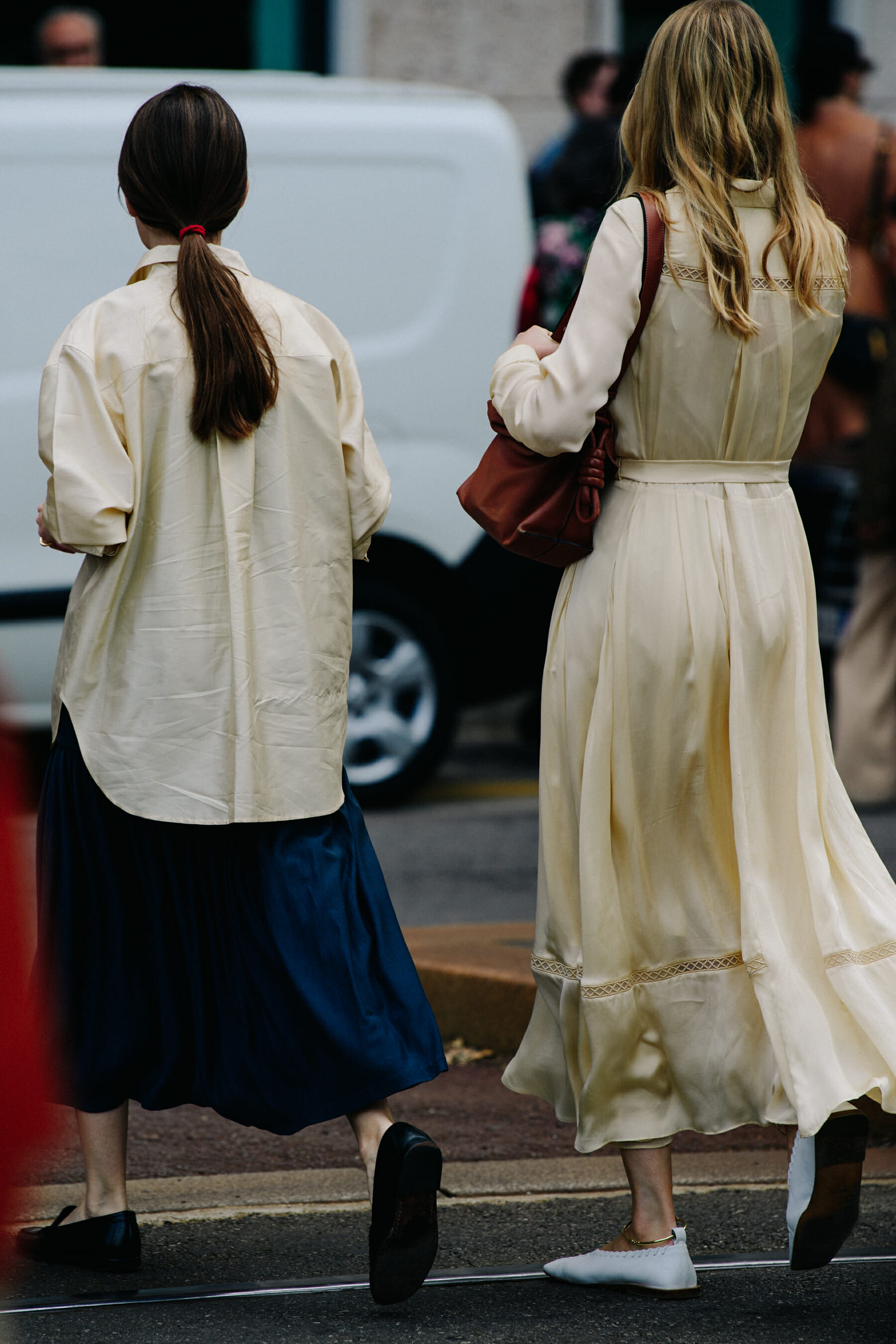 Two women wearing yellow