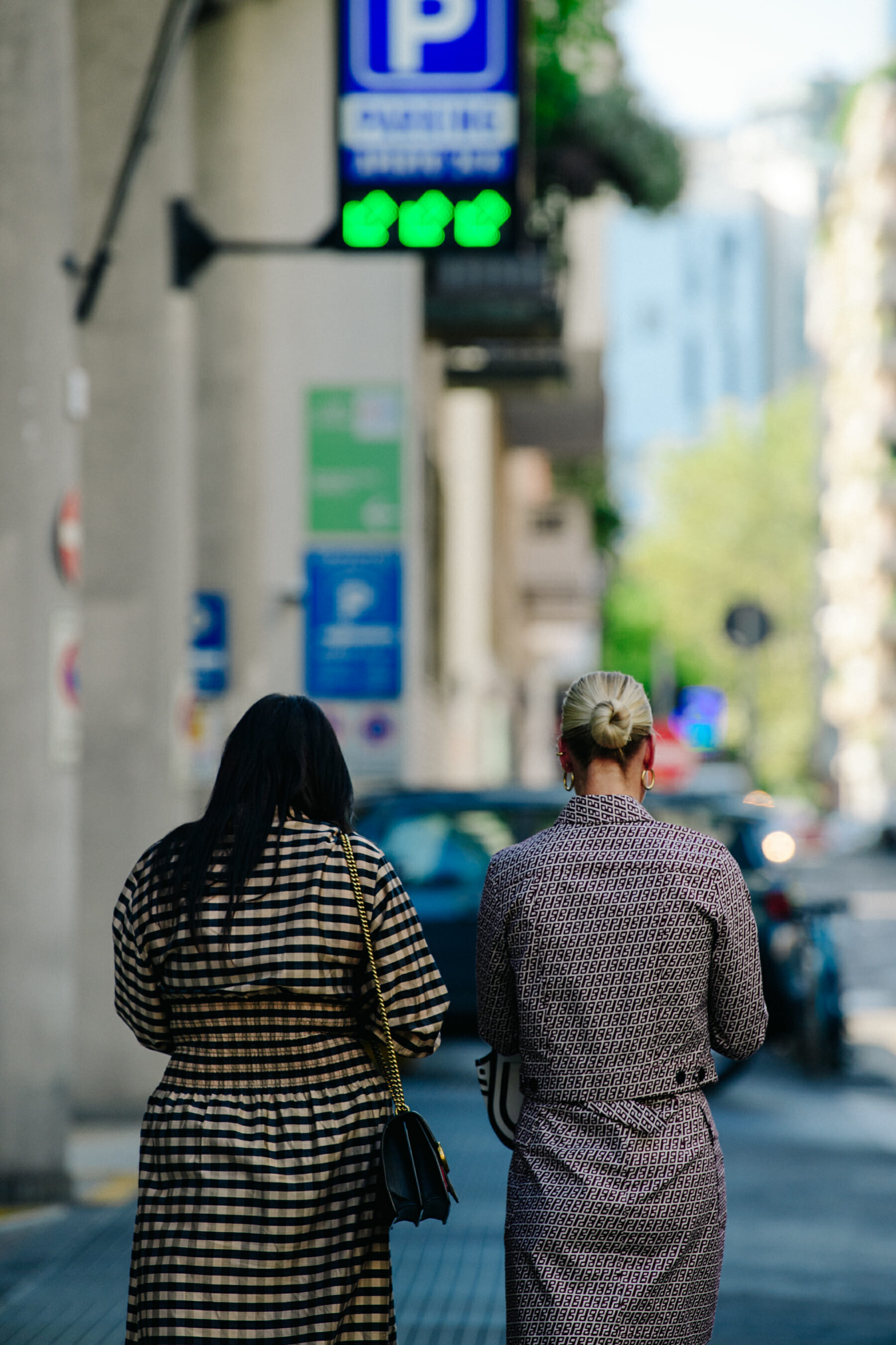 Two women wearing Fendi