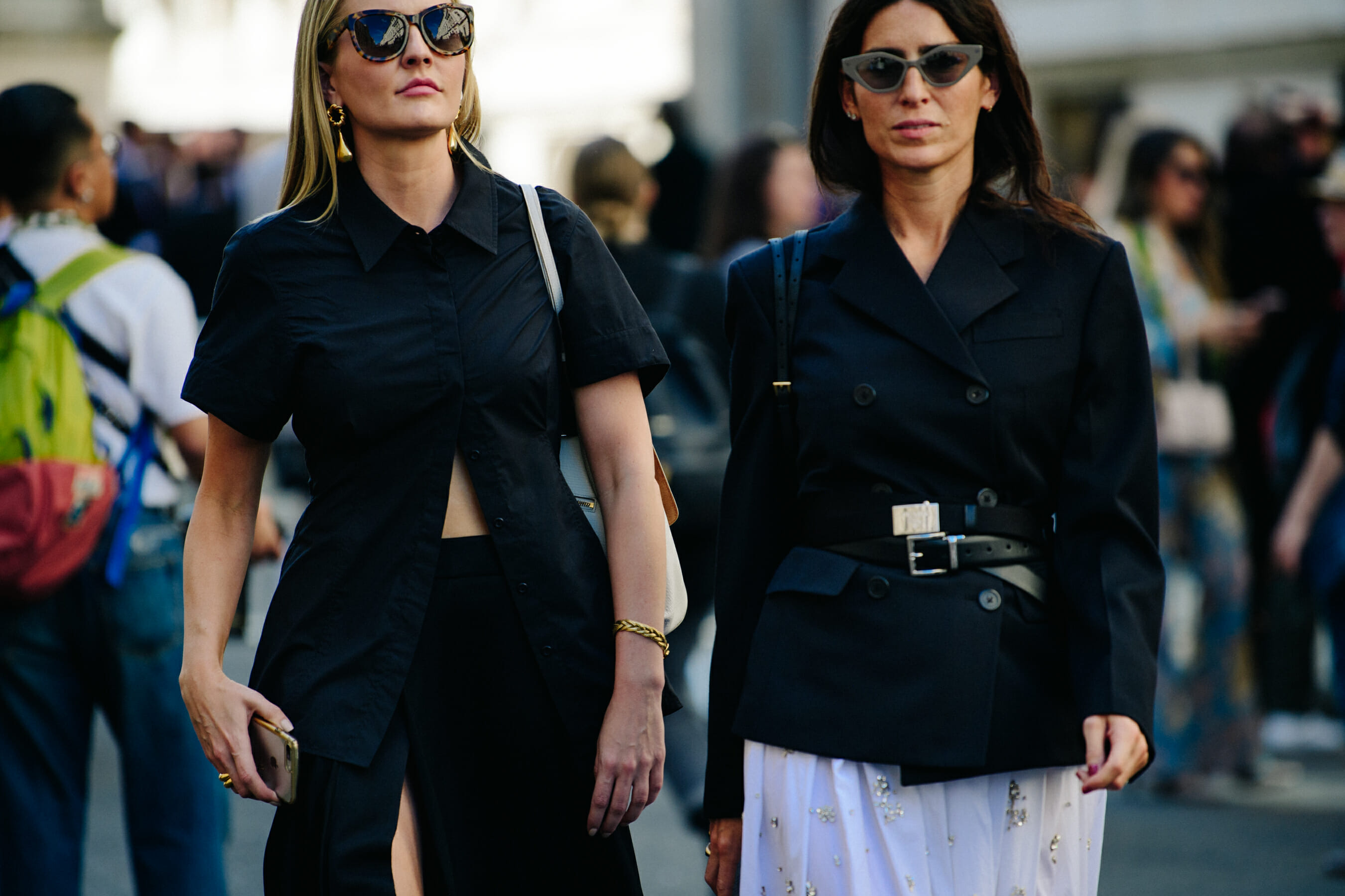 Two women wearing black