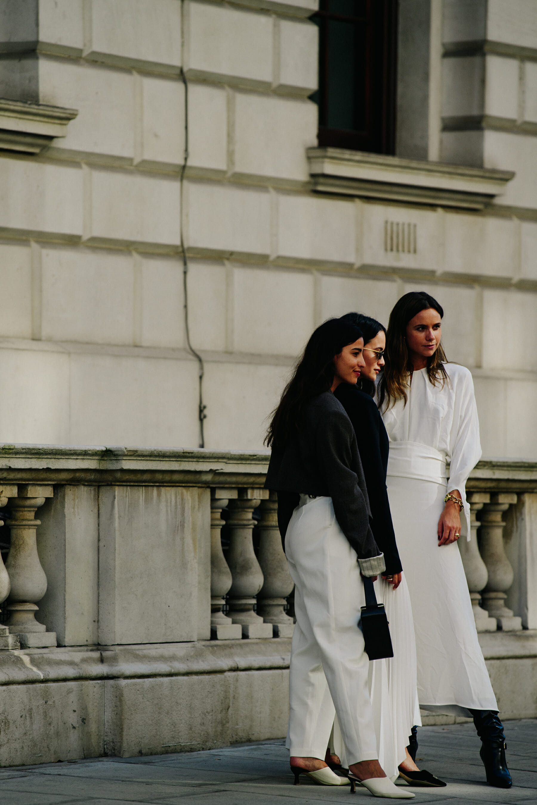 Three bloggers wearing white and black