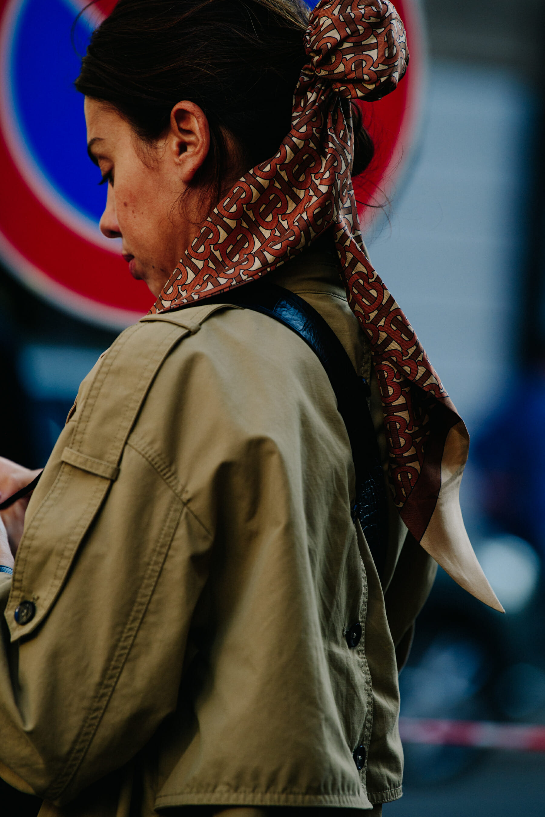 Woman wearing Burberry hairscarf