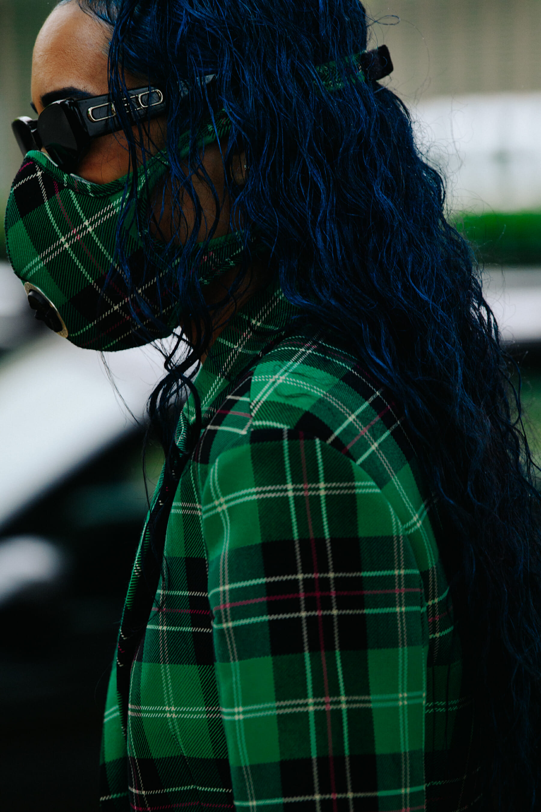 Woman wearing green check facemask