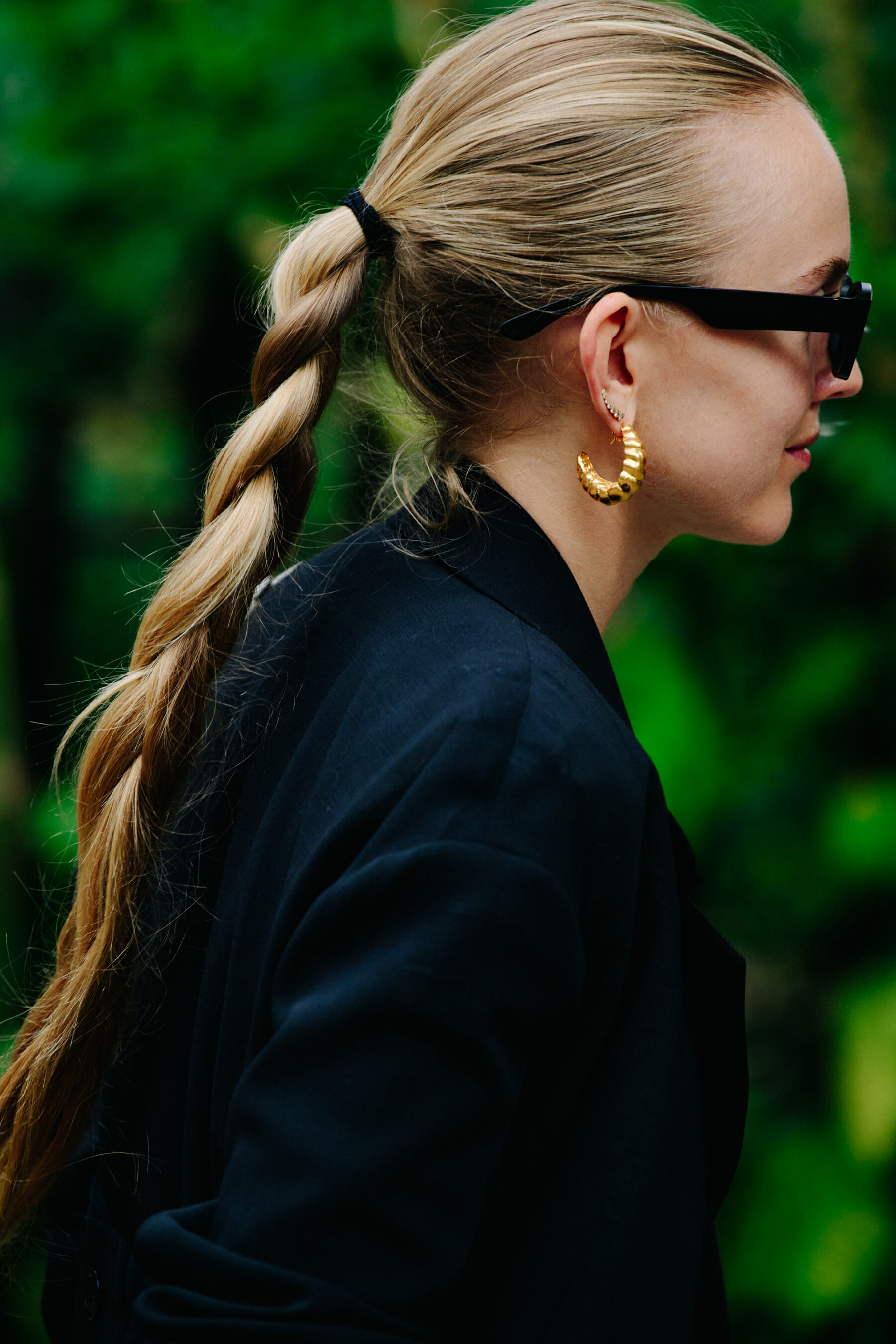 Woman wearing gold earrings