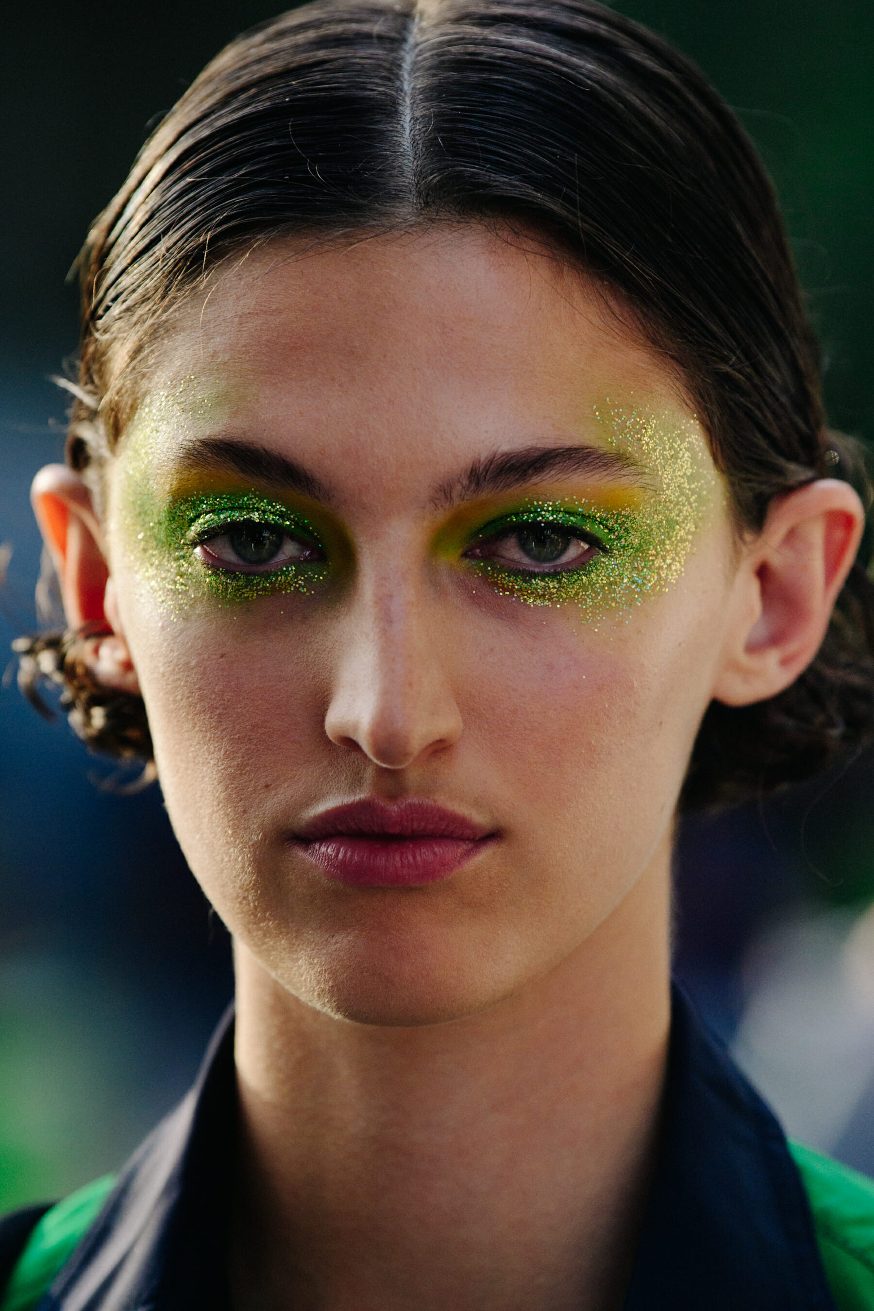 Portrait of model with green eye makeup