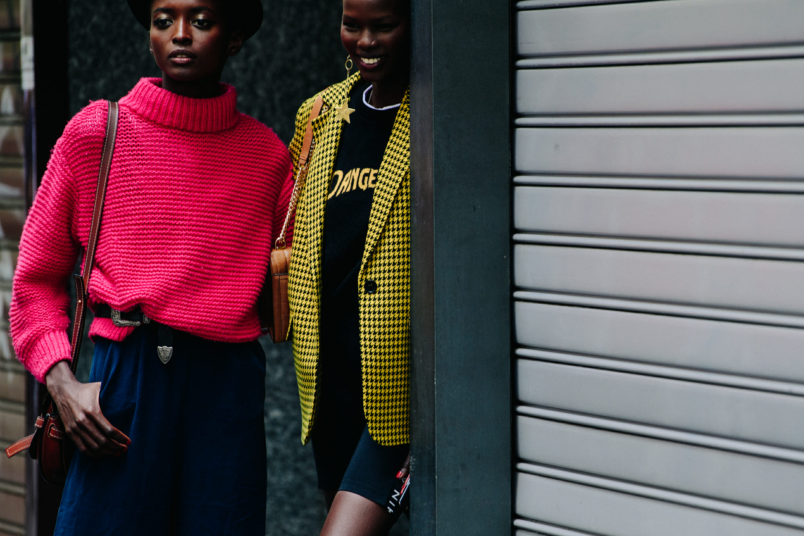 Two models wearing wool jackets