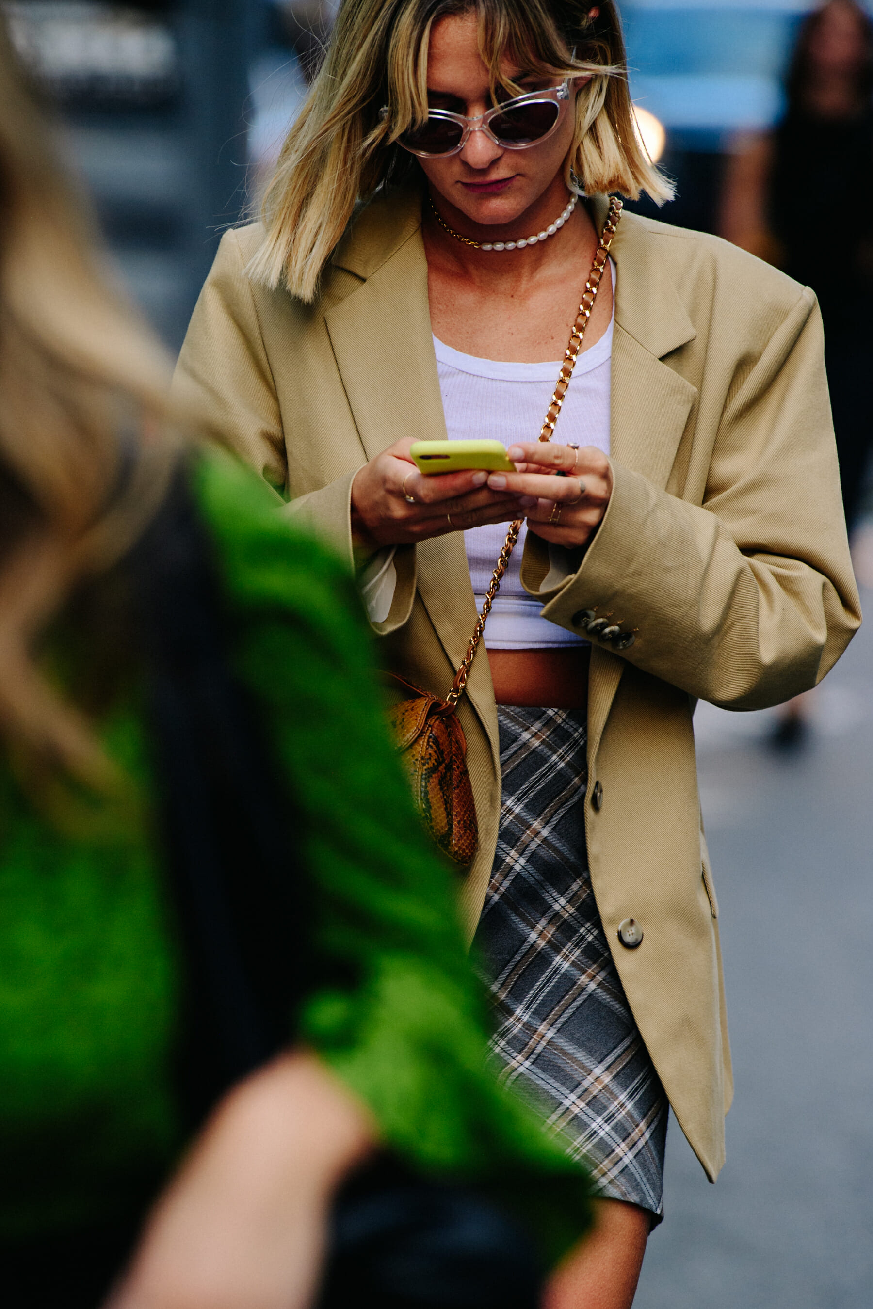 Woman wearing tan jacket