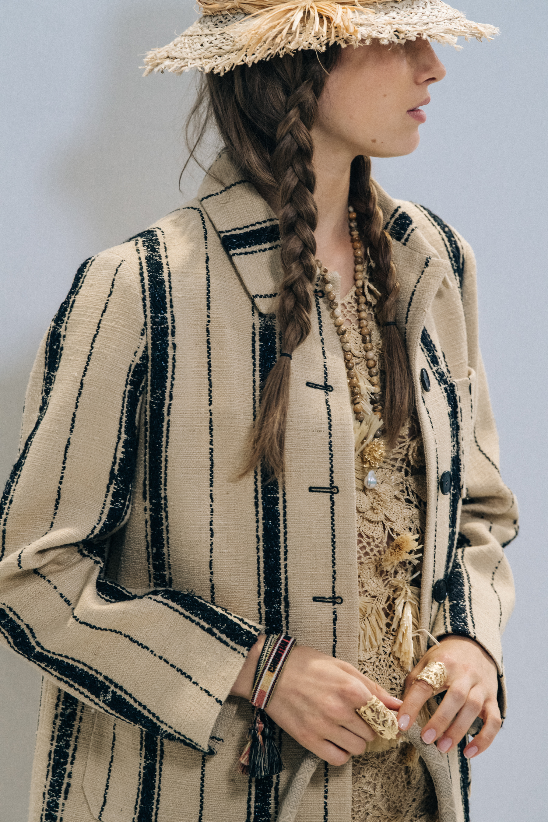 Models wearing straw hats at Christian Dior