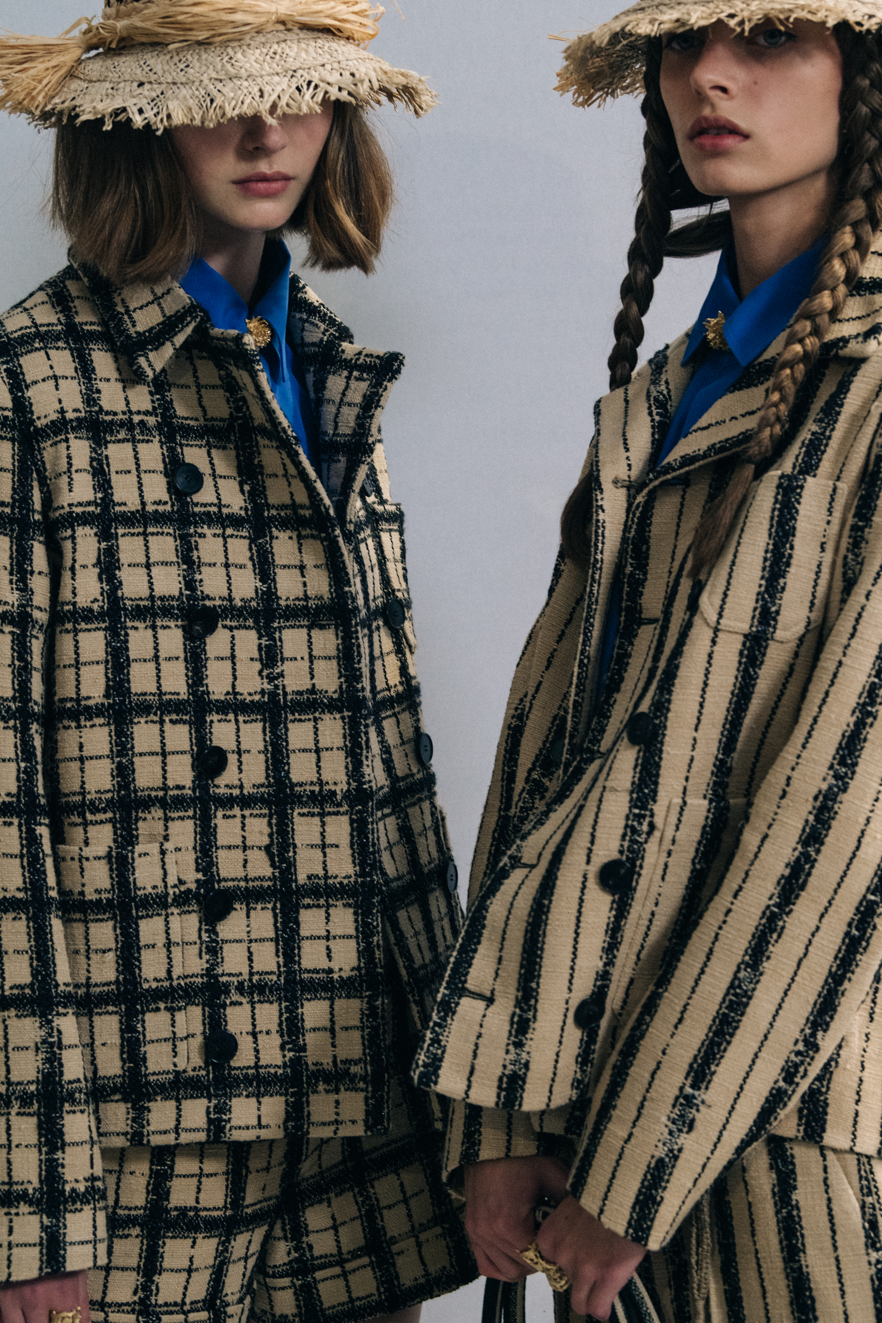 Models wearing straw hats at Christian Dior