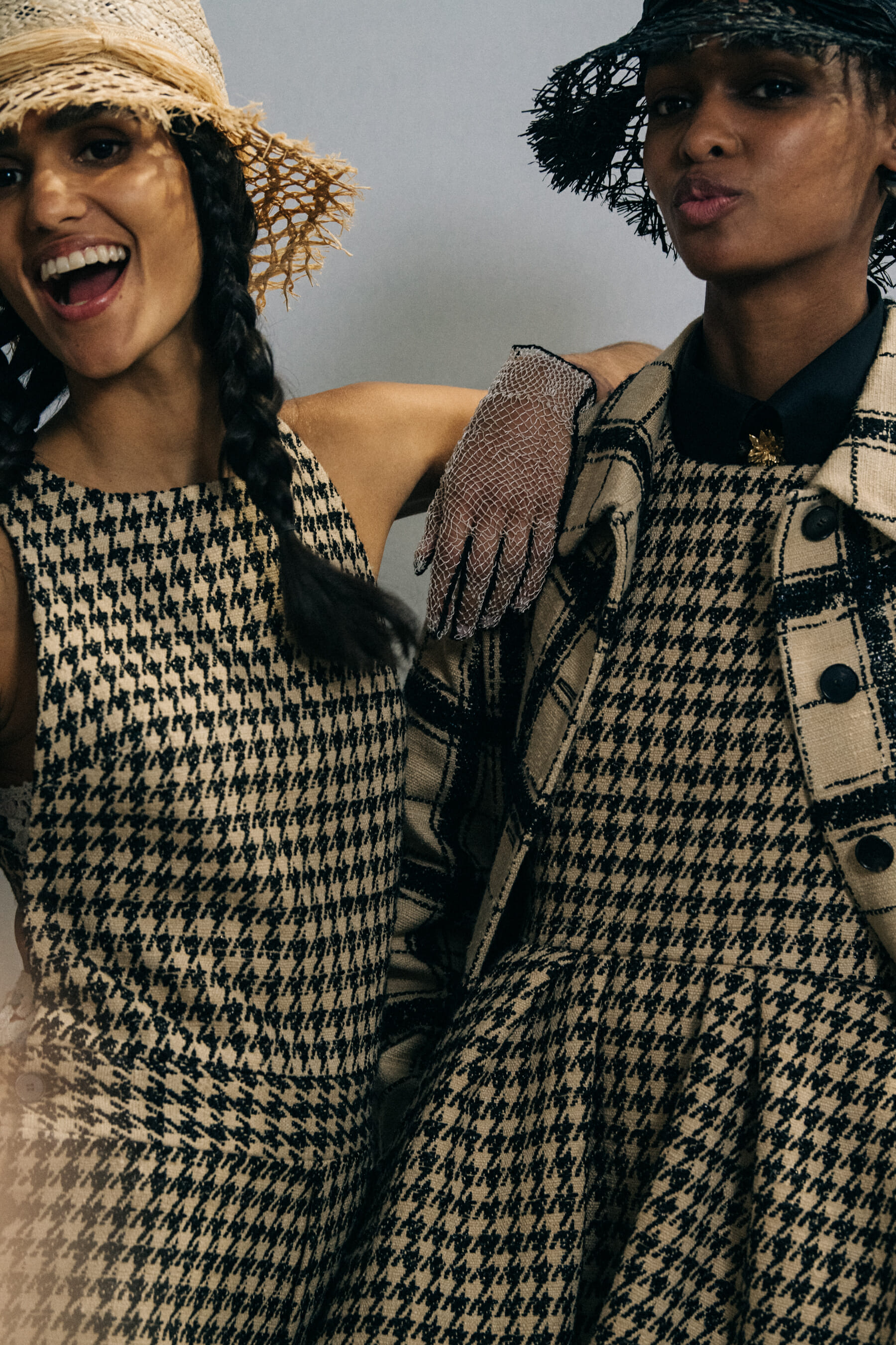 Models wearing straw hats at Christian Dior