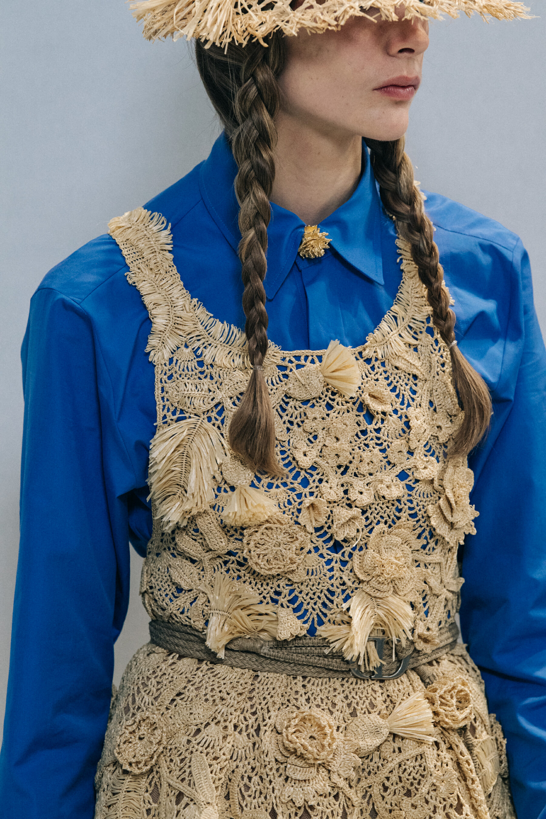 Models wearing straw hats at Christian Dior