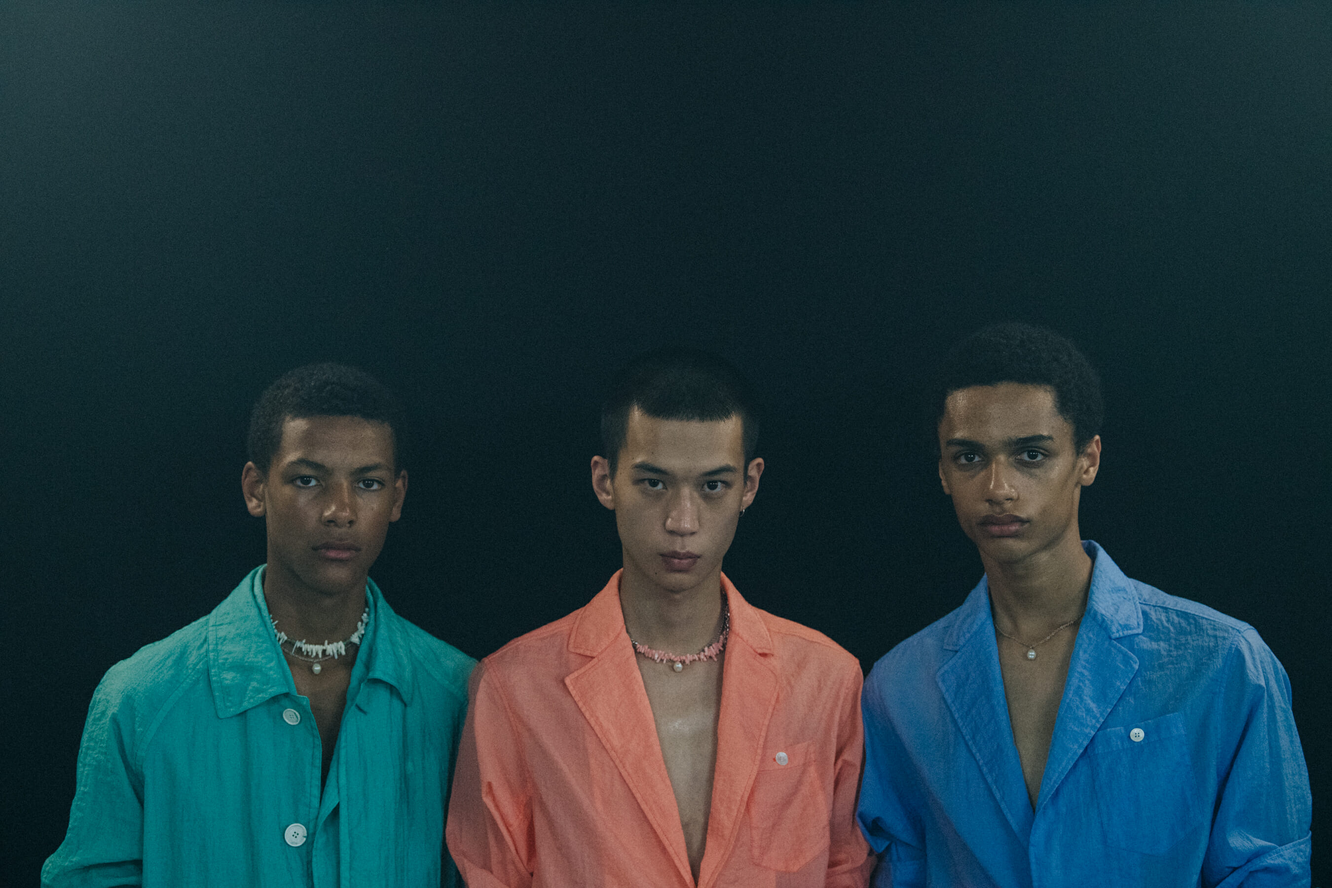 Models wearing colourful outfits at Kenzo