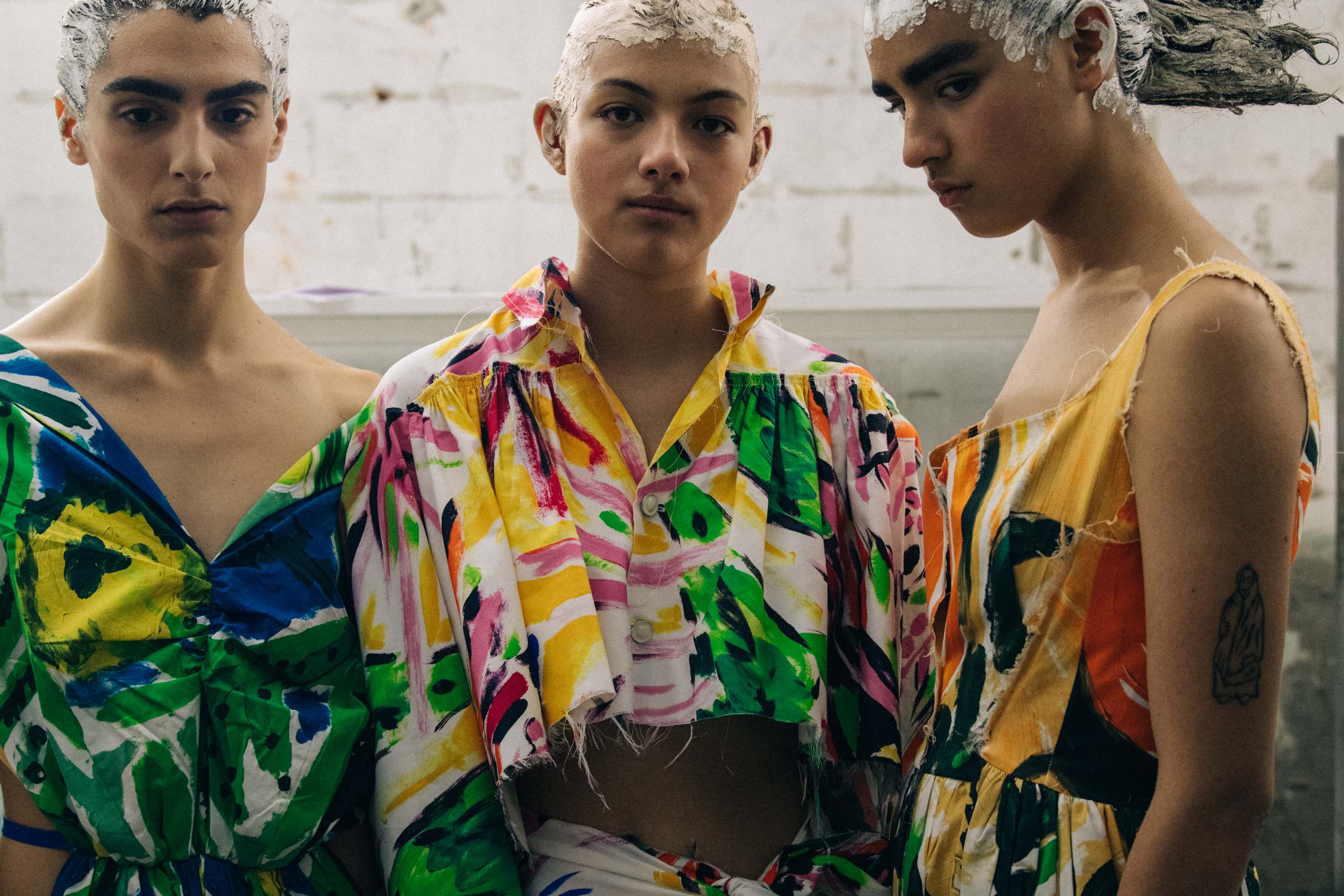 Models wearing colourful dresses at Marni