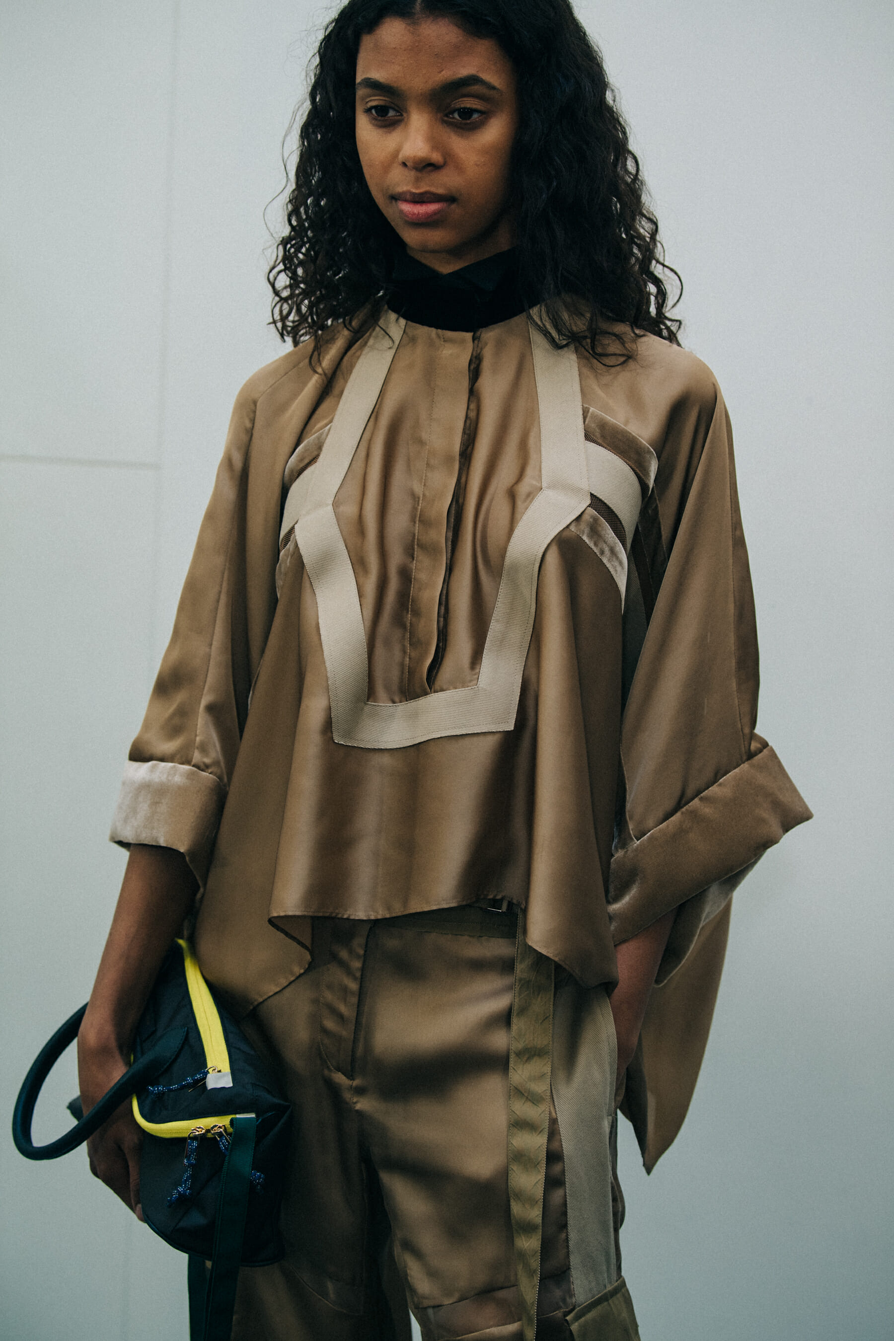 Models wearing Sacai outfits