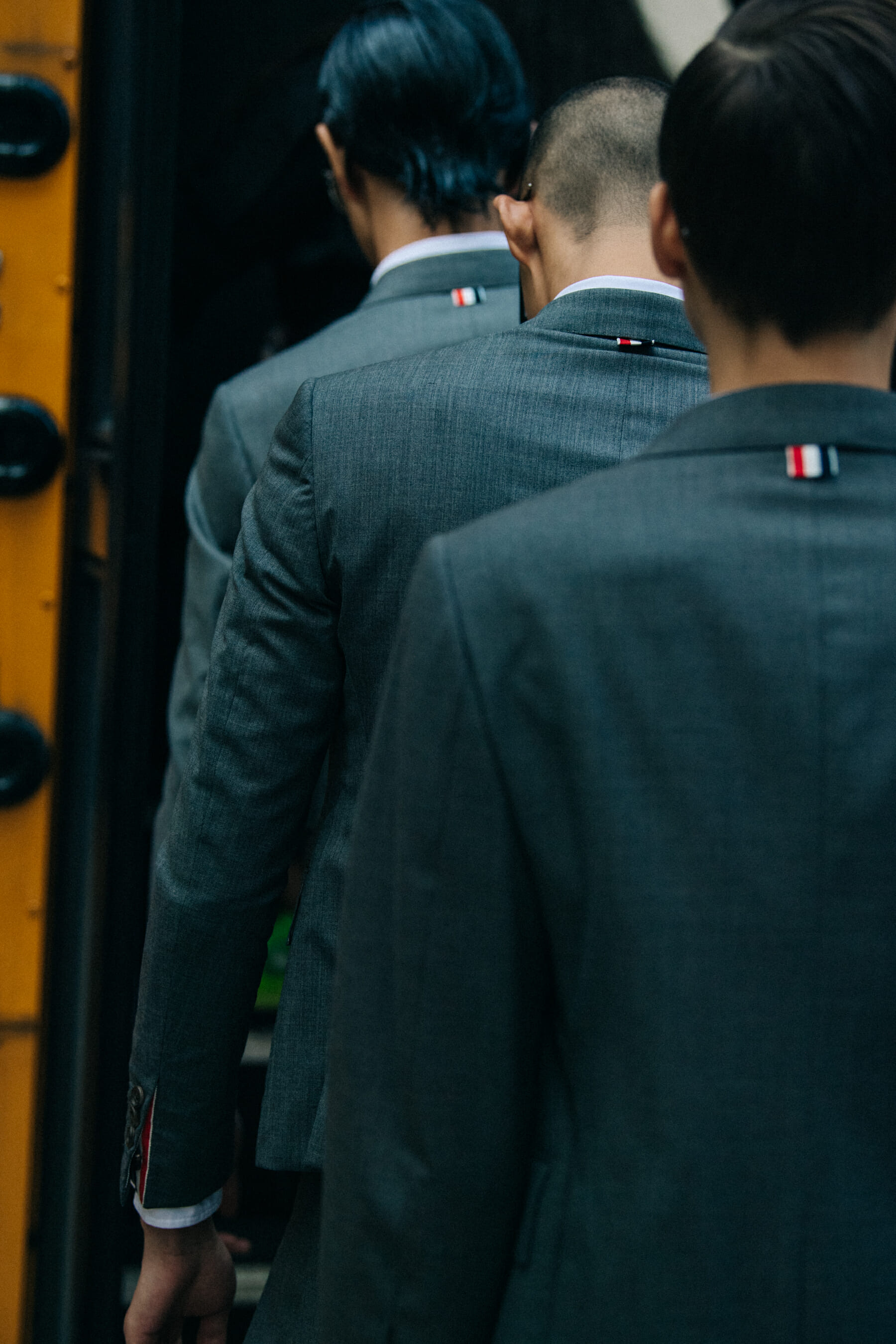 Models wearing Thom Browne suits