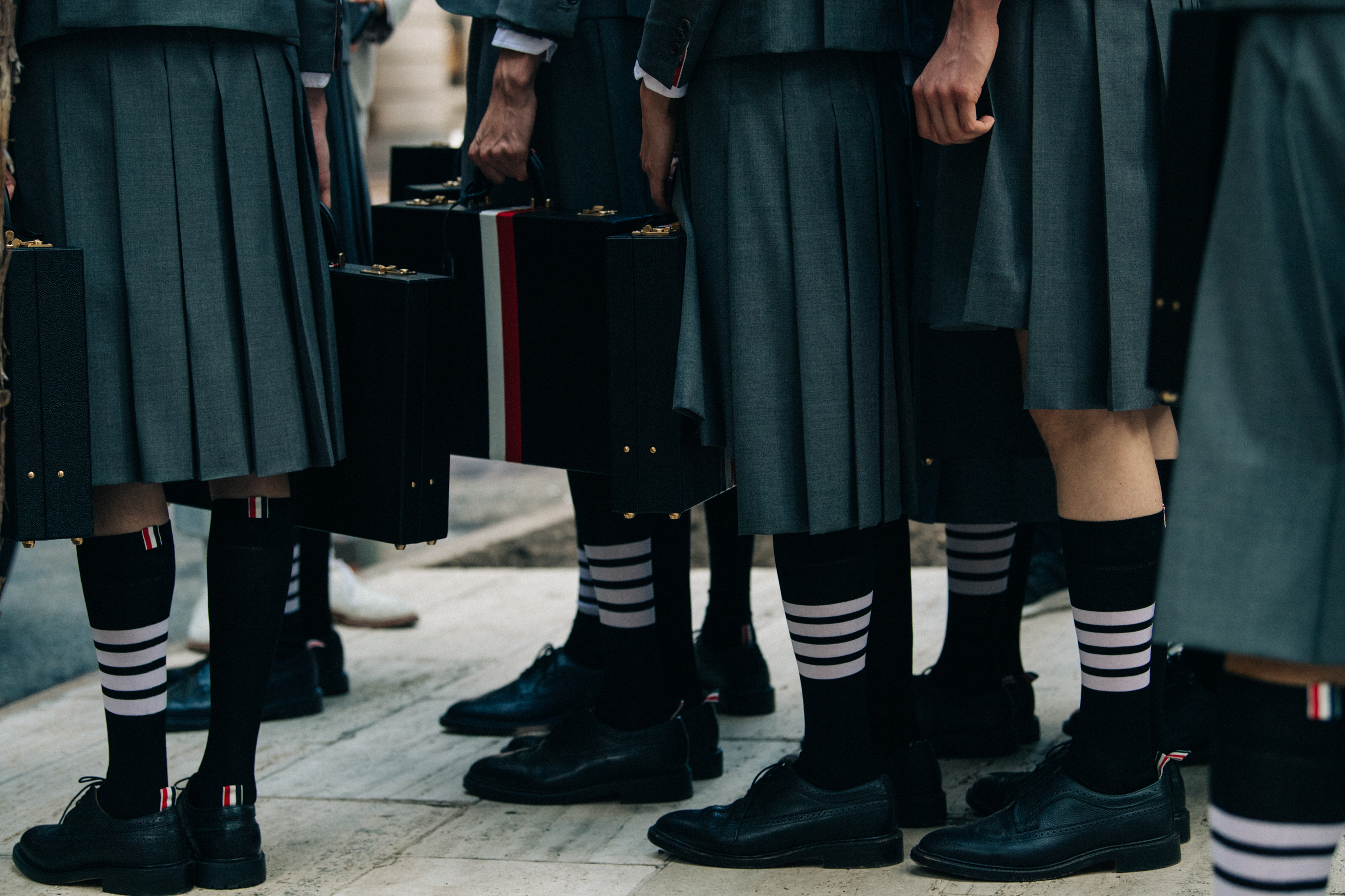 Models wearing Thom Browne suits