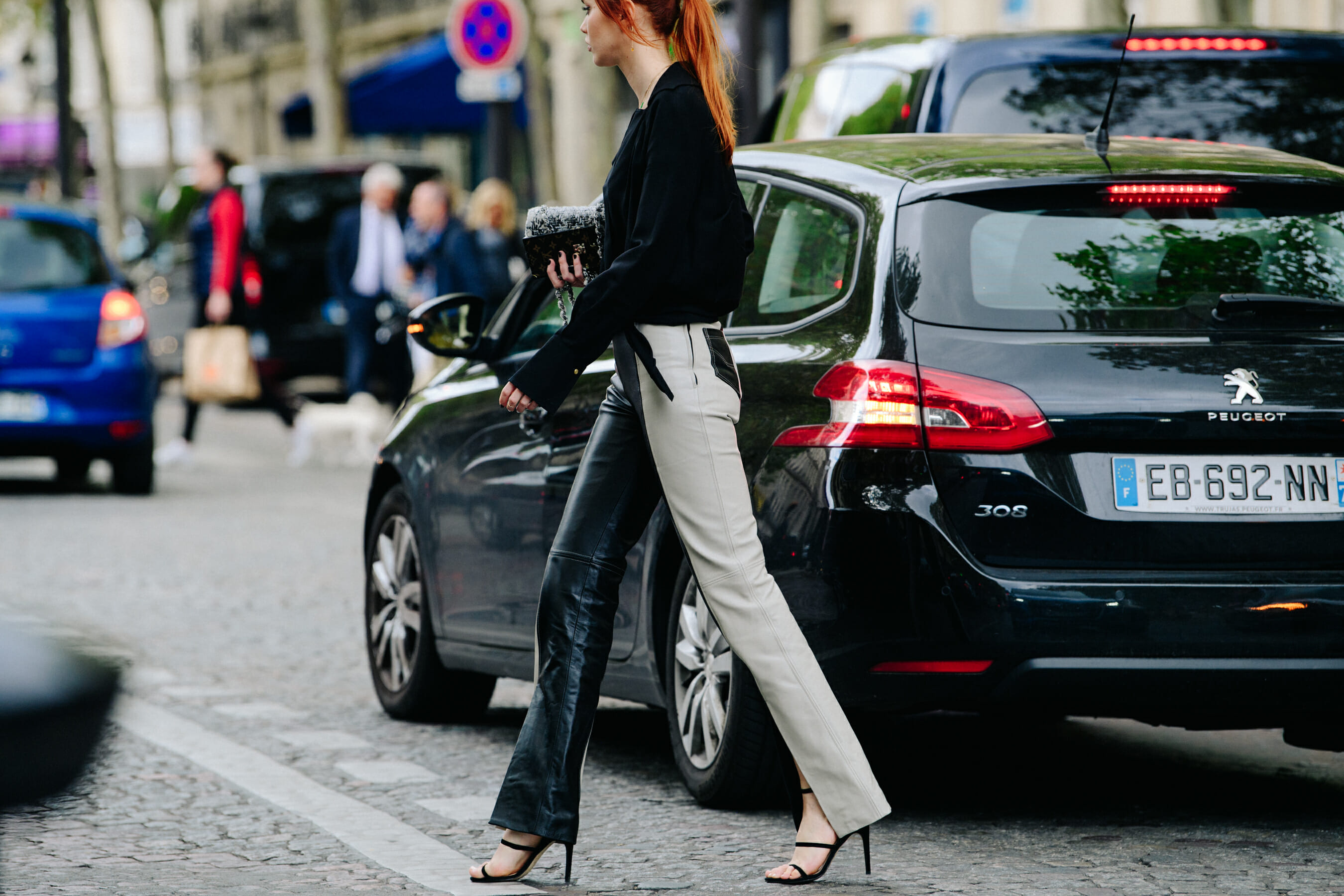 Woman wearing white and black jeans