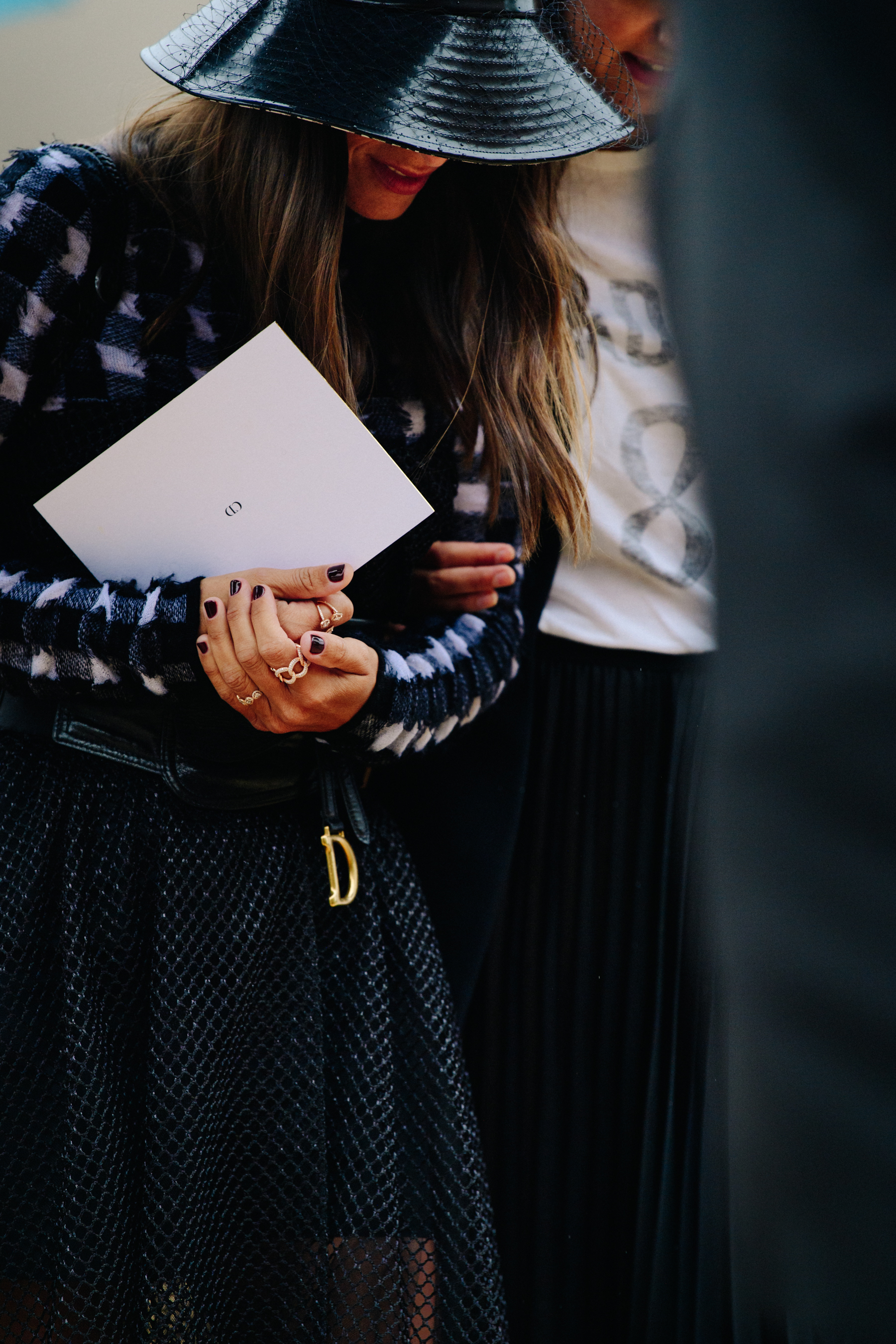Woman wearing black Christian Dior outfit