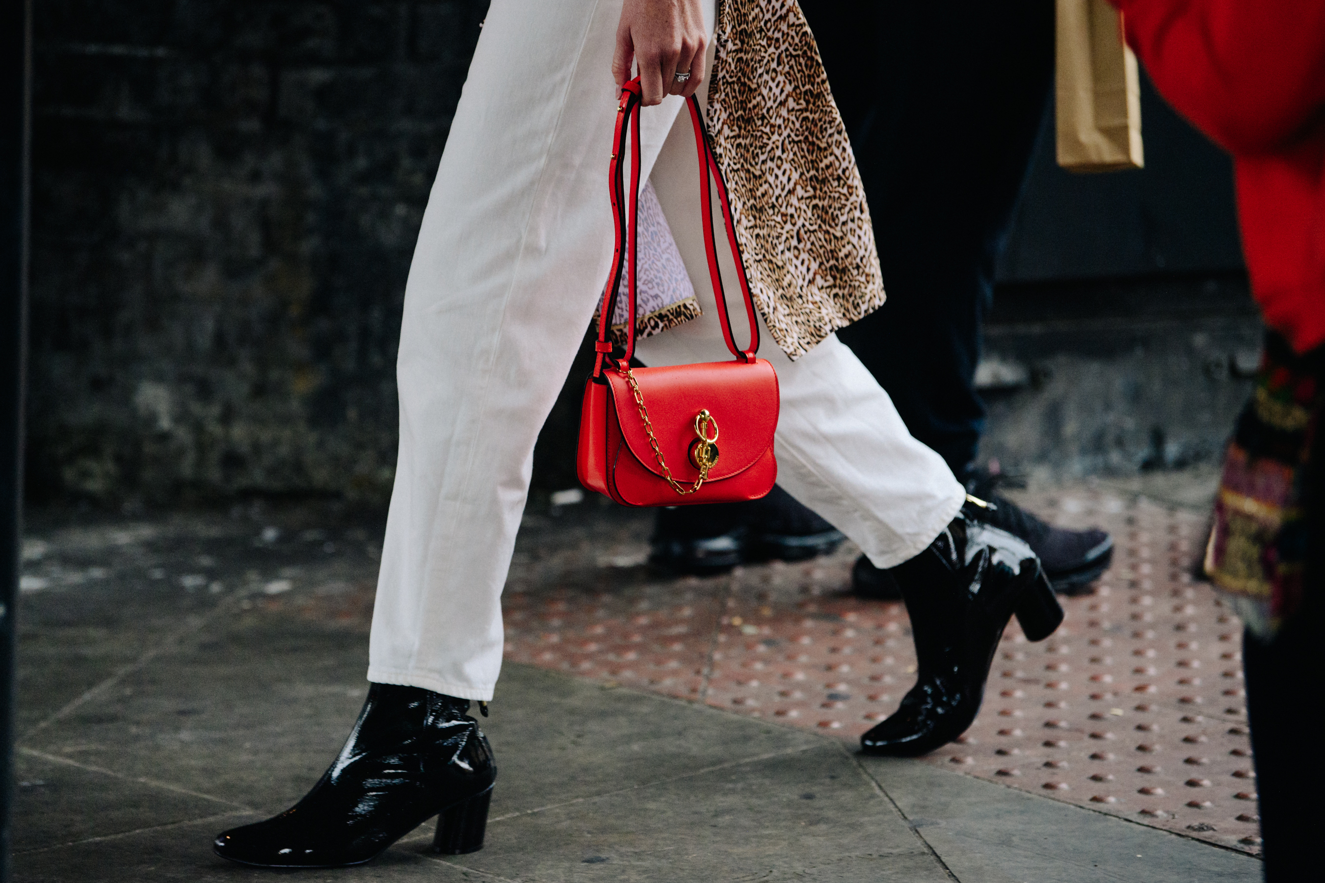 Woman carrying JW Anderson bag