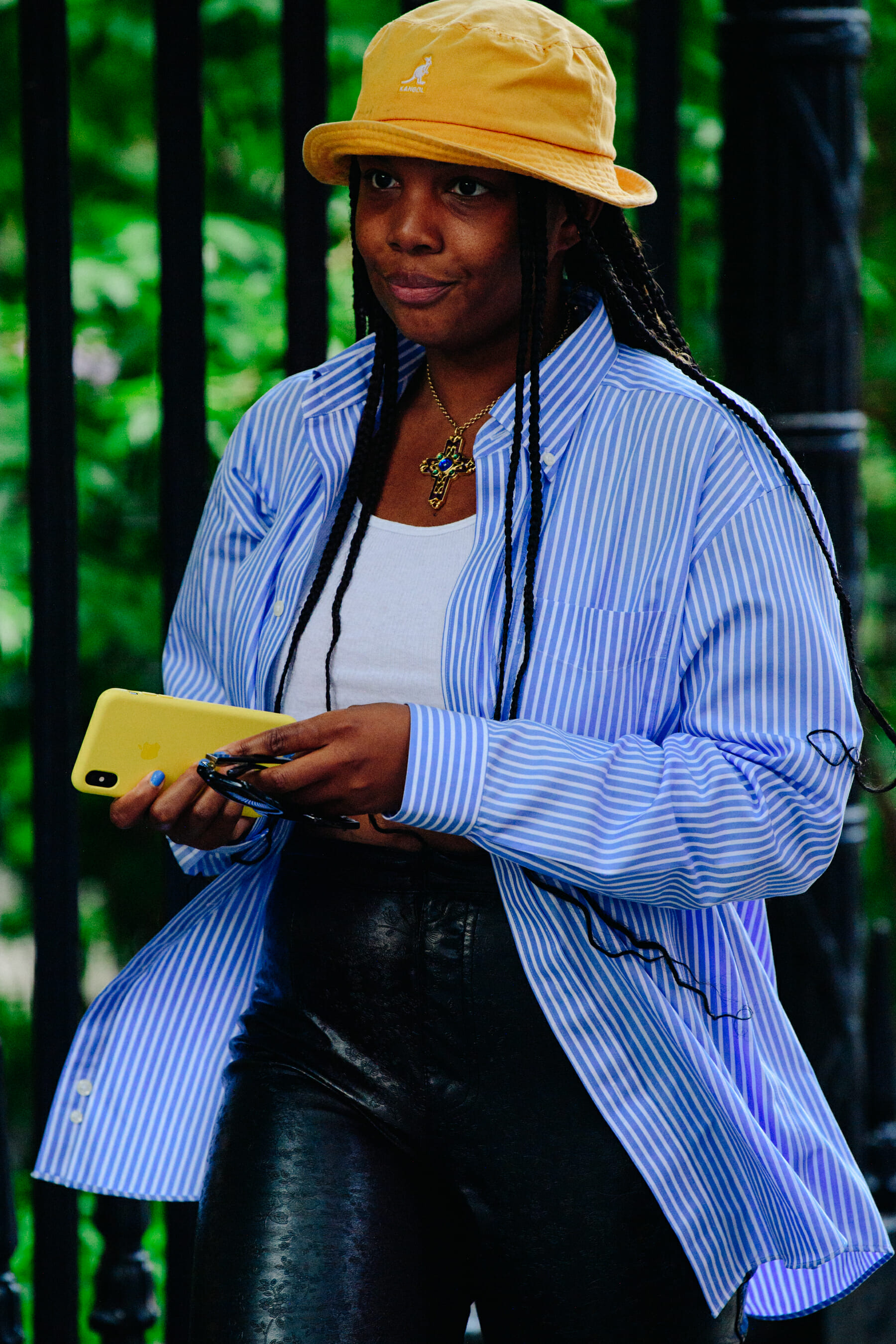 Woman wearing yellow Kangol hat