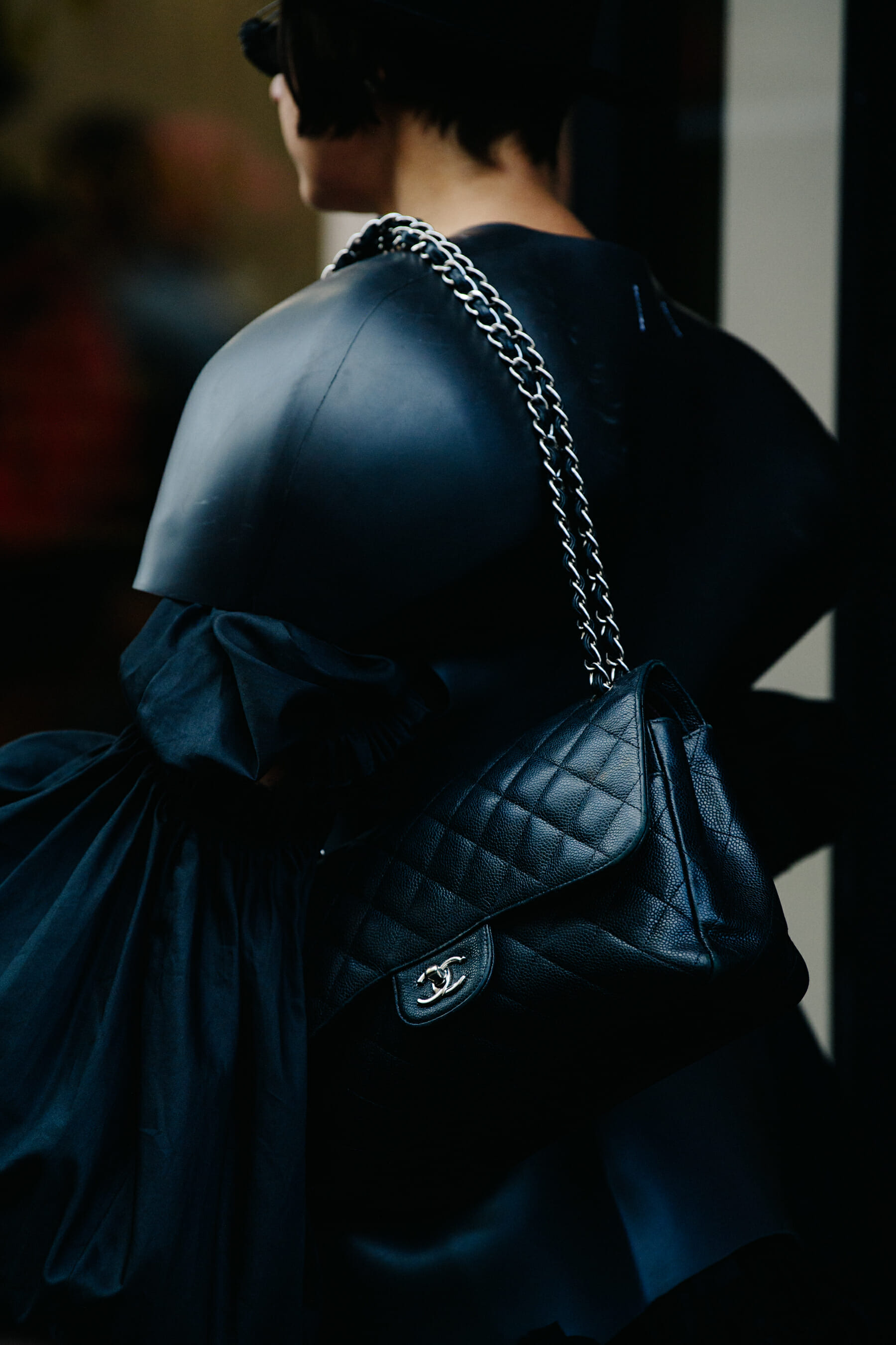 Woman carrying Chanel bag
