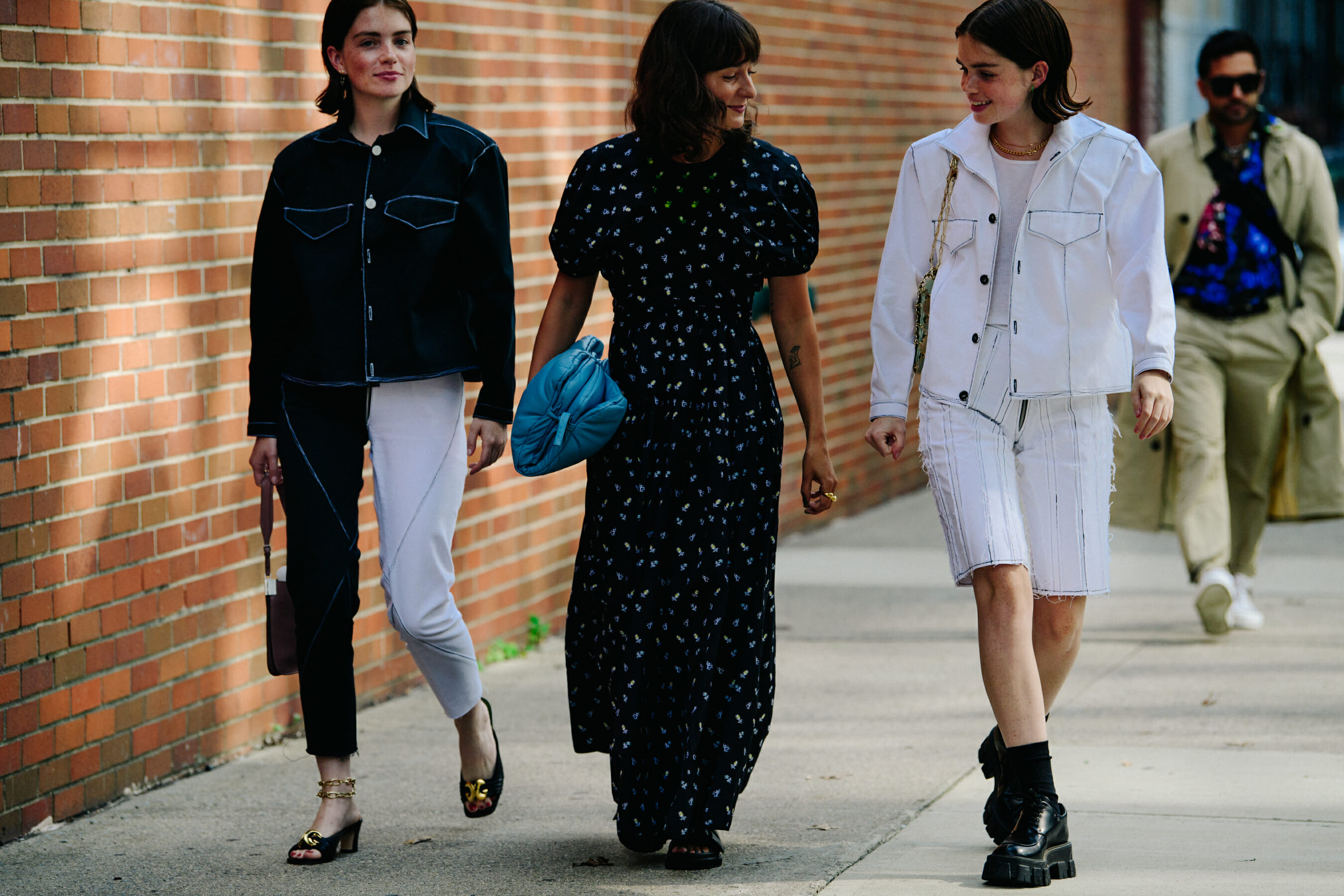 Three women wearing white and black